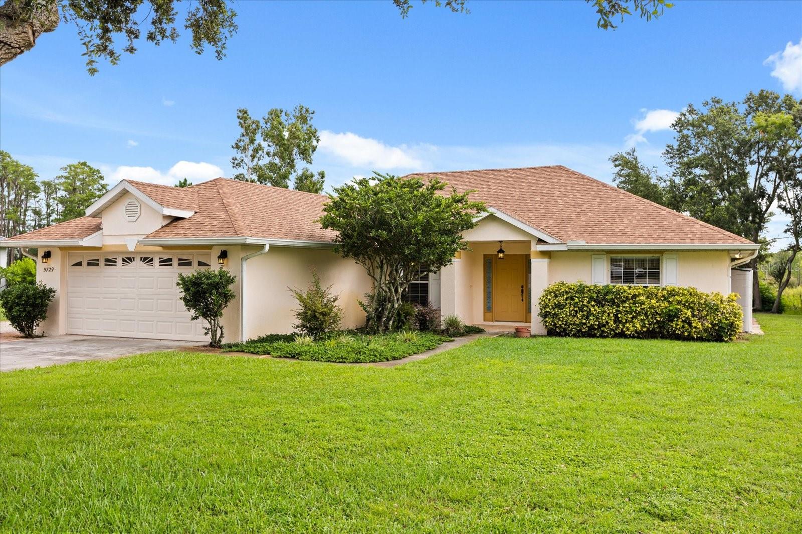 Nestled on a sprawling 5+ acres, this charming 3-bedroom, 2-bath home offers the perfect blend of peaceful country living and modern convenience. This custom-built home features 6" formed and poured concrete exterior walls, offering superior durability, energy efficiency, and peace of mind. Bring your airboat, RV and toys, and start your dream homestead. Inside, you'll love the warm, inviting layout with a spacious living area, split-bedroom floor plan, and a light-filled kitchen featuring stainless steel appliances and ample cabinet space. The primary suite includes a walk-in closet and private bath, while two additional bedrooms allow flexibility for family, guests, or a home office that could also be used as a 4 bedroom/den or formal dining.
Step outside onto the huge back porch, perfect for morning coffee and sunrises. Whether you're gardening, entertaining, or just enjoying the quiet, this property is made for relaxing and reconnecting with nature. No HOA Conveniently located a short drive to downtown Groveland or Clermont, you’ll enjoy the best of both worlds—privacy and convenience
Car lovers, hobbyists, and RV owners—this one’s for you.
Home comes with a 1,200 sq ft , DETACHED 4 CAR GARAGE/WORKSHOP WITH TWO 8-FT DOOR HAS POWER AND WATER offering ample room for vehicles, tools, or a workshop. There’s also a 60x15 metal RV carport—plenty of space to store your boat, camper, or farm equipment.
And for nature lovers, you’ll be thrilled to know the property backs up to the scenic Palatlakaha River system. Originating at Lake Louisa, just south of Groveland, this waterway winds through a chain of sparkling lakes—Susan, Minnehaha, Palatlakaha, Hiawatha, Minneola, Cherry, Lucy, and Emma—before flowing through a beautiful swampy area and into Lake Harris. It’s a slice of real Florida paradise right in your backyard. If you’ve been looking for a private retreat with modern comfort and room to grow—this is it. ROOF 2023 A/C 2021 Schedule your private tour today!