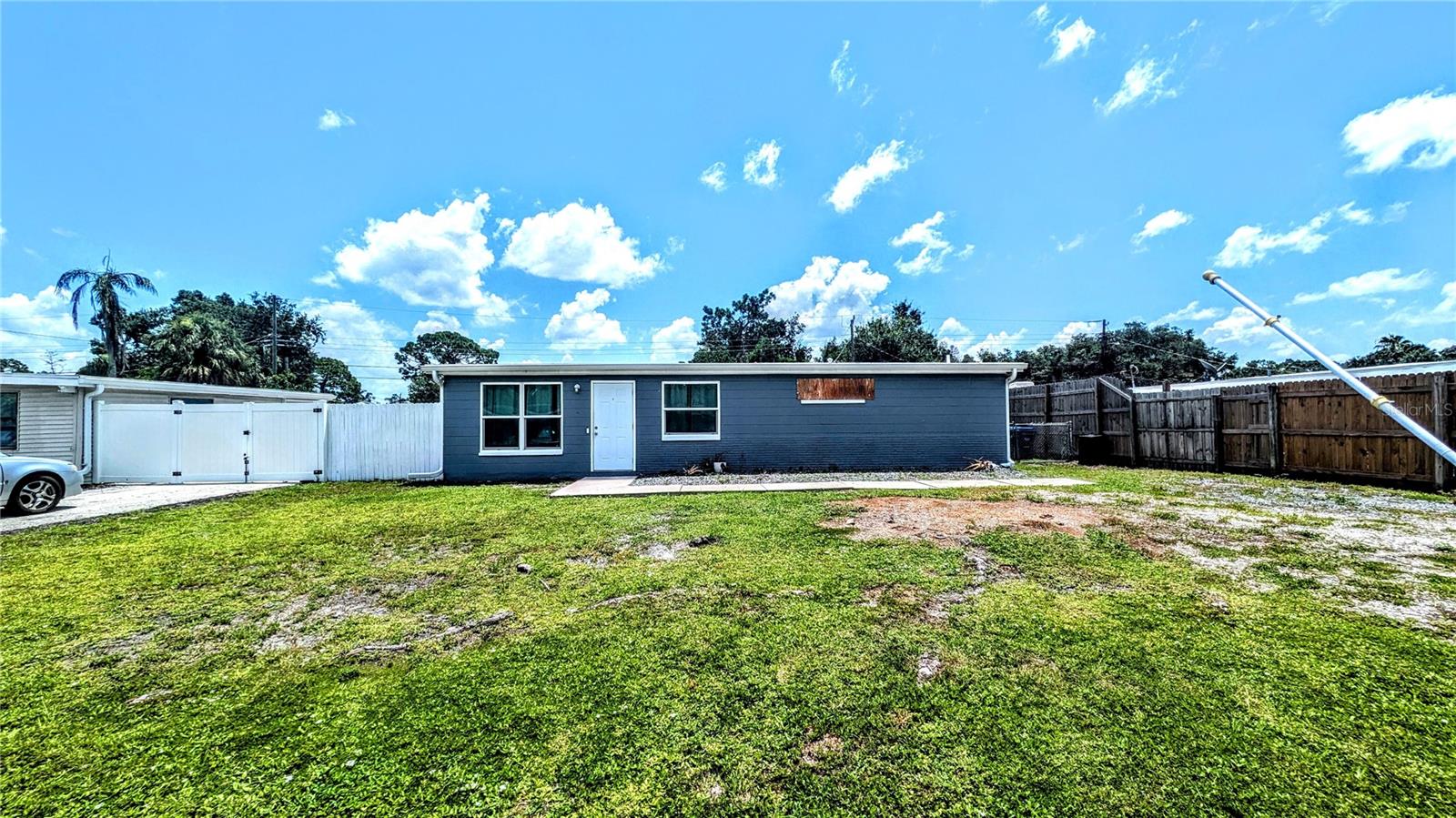 Discover this annual unfurnished 2-bedroom, 1-bathroom updated single-family home in Sarasota, Florida. This charming residence is flooded with natural light, creating a warm and inviting atmosphere. The updated kitchen features solid wooden cabinetry and brand-new appliances. A neutral paint scheme complements the new hardwood floors, offering a modern and cohesive aesthetic throughout the home.
Step outside to a large fenced-in backyard, ideal for outdoor activities and gatherings. The concrete patio, conveniently connected to the back door, offers a great space for relaxation or entertaining. This property is located close to shopping centers and recreational facilities. Commuting is a breeze with easy access to major highways and public transportation options. Pets are welcome, including cats and small dogs, making this home for pet lovers. This property is perfect for those seeking a comfortable and stylish living space in a desirable location. Please call to set up a viewing.