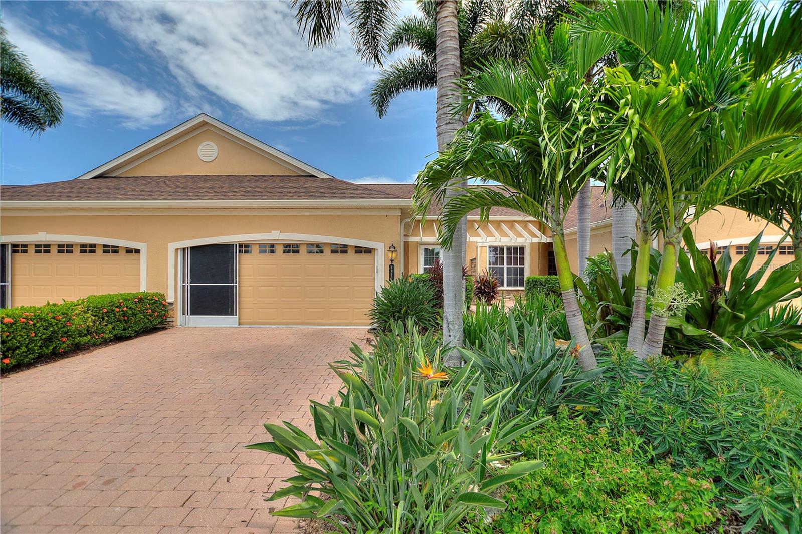 Discover this beautifully maintained villa in the gated, maintenance-free community of Turnberry Trace!
This 2-bedroom, 2-bath home with a 2-car garage also features an enclosed, heated, and cooled Florida room for year-round enjoyment.
Recent upgrades include updated kitchen and baths, a new tankless water heater, new electrical panel, impact windows, roll-down hurricane shutters, and an HOA installed roof for added peace of mind.
The split-bedroom floor plan offers a spacious master suite, a generous guest bedroom, and an open kitchen overlooking a large living room. The enclosed Florida room opens to a shared paver patio, perfect for relaxing or entertaining.
The kitchen is a true delight, featuring 42-inch upper wood cabinets with crown molding, a tile backsplash, solid surface countertops, a breakfast bar, under-cabinet lighting, and stainless steel appliances. Additional highlights include an interior laundry area, ceramic tile throughout the living areas, modern finishes, and designer fixtures.
The garage comes well-equipped with a sliding screen door, upgraded insulation, and storage shelves.
Residents of Turnberry Trace enjoy resort-style amenities, including a community pool, clubhouse, and fitness center. Conveniently located near I-75 and US-41, this community offers easy access to shopping, dining, top-rated schools, pristine Gulf Coast beaches, and all that North Port has to offer.
