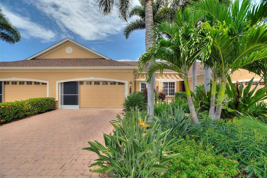 Discover this beautifully maintained villa in the gated, maintenance-free community of Turnberry Trace!
This 2-bedroom, 2-bath home with a 2-car garage also features an enclosed, heated, and cooled Florida room for year-round enjoyment.
Recent upgrades include updated kitchen and baths, a new tankless water heater, new electrical panel, impact windows, roll-down hurricane shutters, and an HOA installed roof for added peace of mind.
The split-bedroom floor plan offers a spacious master suite, a generous guest bedroom, and an open kitchen overlooking a large living room. The enclosed Florida room opens to a shared paver patio, perfect for relaxing or entertaining.
The kitchen is a true delight, featuring 42-inch upper wood cabinets with crown molding, a tile backsplash, solid surface countertops, a breakfast bar, under-cabinet lighting, and stainless steel appliances. Additional highlights include an interior laundry area, ceramic tile throughout the living areas, modern finishes, and designer fixtures.
The garage comes well-equipped with a sliding screen door, upgraded insulation, and storage shelves.
Residents of Turnberry Trace enjoy resort-style amenities, including a community pool, clubhouse, and fitness center. Conveniently located near I-75 and US-41, this community offers easy access to shopping, dining, top-rated schools, pristine Gulf Coast beaches, and all that North Port has to offer.
