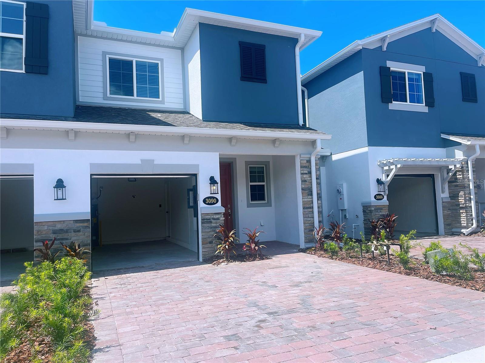 Spacious 3 bed, 2.5 bath townhome with loft, garage and private paver driveway. Newer home built in 2023. First floor features a covered front entry, a huge great room, designer kitchen, powder room, cozy lanai, under stairs storage area, and one car garage. In the kitchen, brand new GE stainless steel appliances, granite countertops, gleaming white 42" cabinets with plenty of storage, large island with sink, and a separate food pantry. The downstairs floor is covered with beautiful plank ceramic tiles. The carpeted upstairs features 3 bedrooms with a loft separating the master bedroom from the other bedrooms. The master bedroom includes a huge walk-in closet, private bath with garden tub and separate shower, lavatory, and dual vanity sinks with ample storage. The large loft is the perfect area for an entertainment room, play area, home office or exercise area. The upstairs laundry room includes a new washer and dryer. This Oviedo/Winter Springs area home is located just minutes from the Central Florida Greenway Rt 417, with quick access to Rt 408, UCF, downtown Orlando, and numerous local shopping and dining experiences.