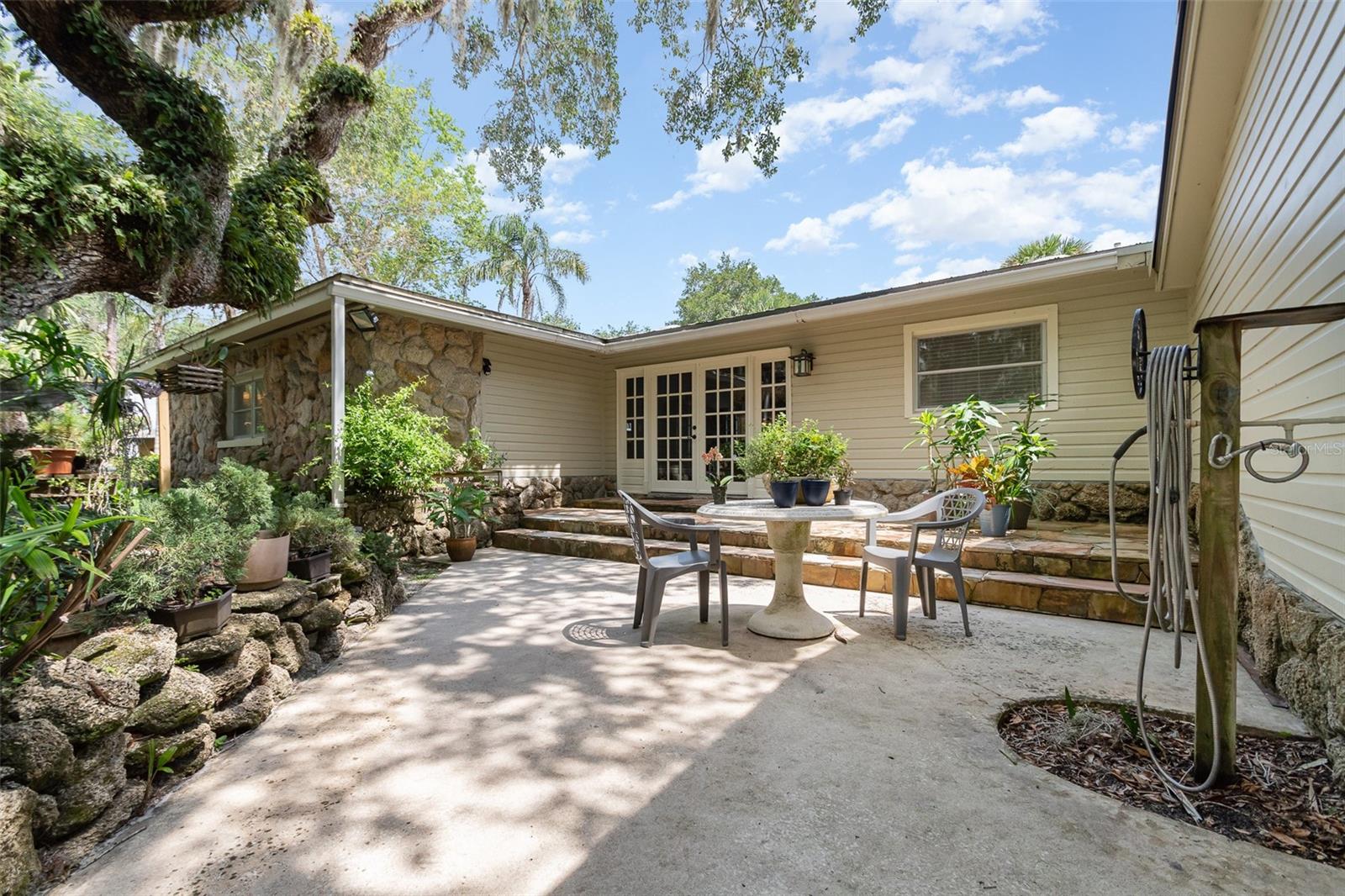 Looking for LAKEFRONT living? Come check out this charming craftsman style home sitting on 1.11 acres of WATERFRONT on Lake Harney in Geneva. Wake up to breathtaking sunrises over the lake, along with endless fishing and boating from your own spacious back yard. With almost 100ft of LAKE frontage this place is sure to impress all your friends and family while creating lasting memories. This lakefront retreat includes 3 bedrooms, 3 baths, an office/study, or possible 4th bedroom, a large living room and a bonus family room, both with stunning lake views, along with a stone wood burning fireplace. You'll fall in love with the stylish galley style kitchen with granite countertops, newer stainless-steel appliances, pine tongue & groove beaded ceilings which add a stylish pop, which continue to flow throughout the home! This is the perfect place for ENTERTAINING and would be ideal for a large family! AND for you GUYS, you must check out this large garage, with enough room for all your TOYS, the perfect mancave/workshop!! This place is like your own private paradise... with large majestic oak trees, rock gardens, beautiful flagstone entryway, along with wildlife and the perfect view of rocket launches, over the lake. COME AND SEE FOR YOURSELF....ALL THAT THE LAKE LIFE HAS TO OFFER and NO HOA! This property is completely fenced in, and a survey is also available. Upgrades include AC 2018, septic pumped in 2024, roof 2019 & 2023, electrical panel 2022. CALL AND SCHEDULE YOUR PRIVATE SHOWING TODAY!