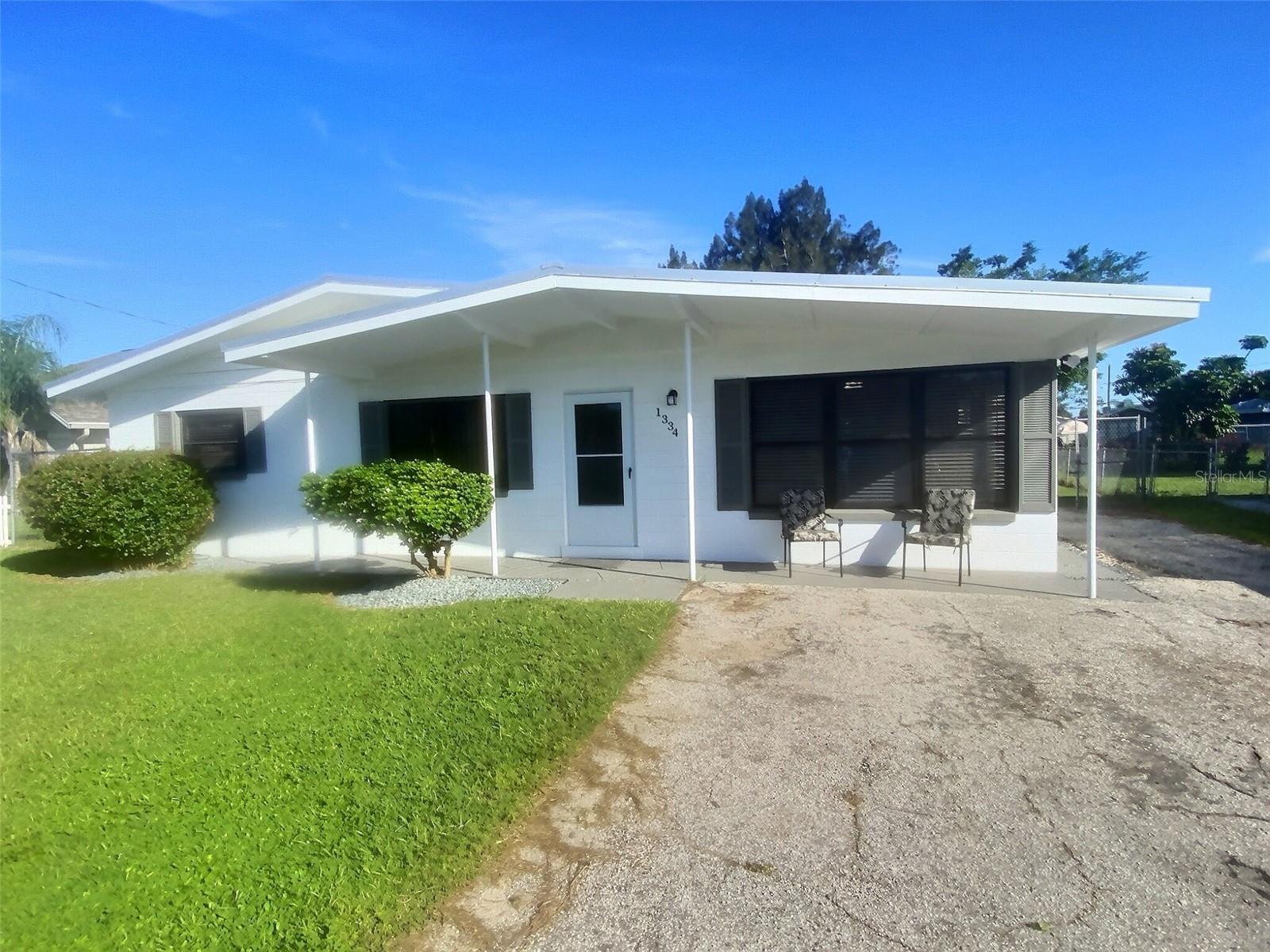 Welcome to this beautifully updated 2-bedroom, 1-bath home nestled in one of Northern Sebring's most sought-after neighborhoods. Perfectly situated between Lake Jackson and Lake Sebring, this property offers the best of convenience and tranquility. Located just two blocks North of Sebring Parkway, you'll be only five minutes from Walmart, Publix, Winn Dixie, popular restaurants, and Hwy 27. Home features: New Roof 2021, McElroy Metals 26-guage Galvalume Max-Rib exposed fasteners, rated for 160mph winds, with a 25-year warranty, New HVAC 2023: Carrier 2.5-ton central heat and A/C system with duct sanitation, new thermostat, and a 10-year warranty, Completely remodeled eat-in kitchen with new cabinets, countertops, sink, stove, refrigerator, ceiling fan, fresh paint, and laminate flooring, Both bedrooms have been freshly painted with new ceiling fans in each room. Bathroom freshly painted with new vanity, window, and adjacent hall linen closet, living room freshly painted with new vertical blinds, bonus room 11X17, freshly painted with new laminate flooring, ceiling fan, blinds, and private exit door-ideal for an office, playroom, or guest space, laundry room freshly painted, washer/dryer hookups, new window, and organizational shelving, New hot water heater, exterior of home freshly painted. Additional features: polished terrazzo floors in living area, new front and back doors, updated exterior light fixtures, attic storage. Large- fenced backyard with gated entry-perfect for pets or entertaining, parking pad in backyard plus a wide driveway with room for two cars. This home is in a well-established, quiet neighborhood, with new construction nearby. With major updates already completed, all that's left is for you to move in and make it your own.