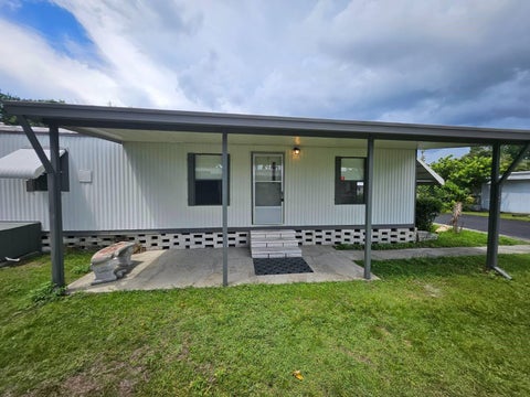 Photo of 6445 Belle Terre Rd, New Port Richey, FL 34653 (MLS # TB8535587)