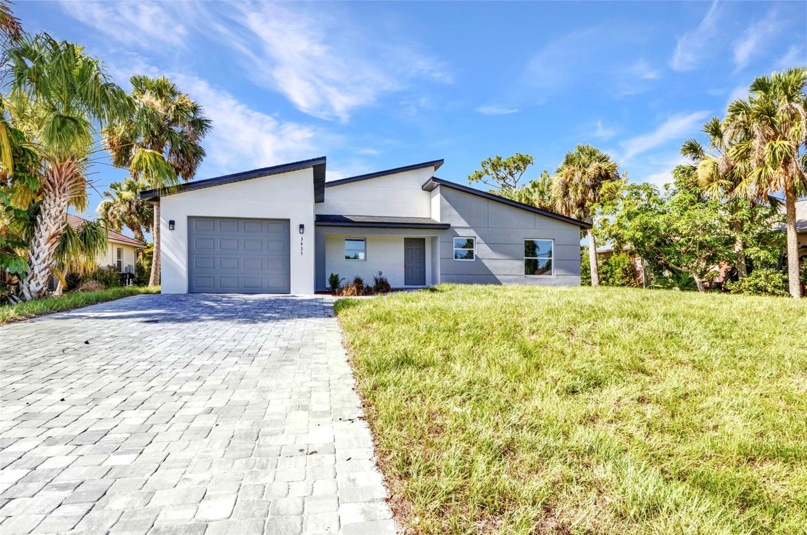 This brand new 4-bedroom, 2-bathroom contemporary modern home is ready for you to move in and enjoy. Built with quality and comfort in mind, it features tile flooring throughout, granite countertops, stainless steel appliances, and hurricane impact windows for peace of mind.
The open kitchen and living area offer a clean, modern feel with plenty of natural light. The primary suite includes a tiled walk-in shower, soaking tub, and a large walk-in closet. The second bathroom is also fully tiled and easy to maintain.
All ceiling fans and lighting fixtures are installed, so there's nothing left to do but move in. Outside, you'll find a pavered driveway and simple, modern curb appeal.
Located just minutes from shopping, restaurants, and with quick access to the highway. You're also a short drive from beautiful beaches and popular amusement parks