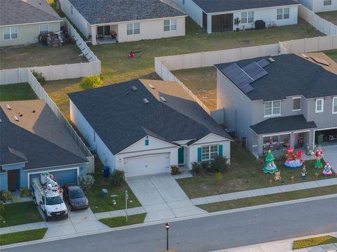 Photo of 702 Peyton Brooke Way, Winter Haven, FL 33881 (MLS # TB8450784)