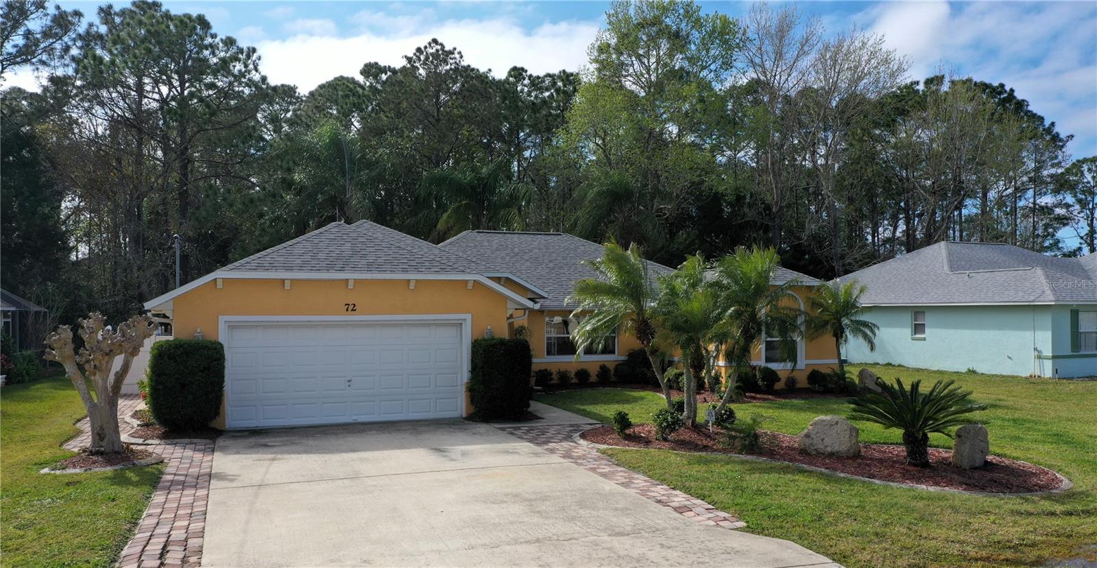 Stunning 3/2 Pool Home in Pine Lakes. This house has been meticulously upgraded using top quality products with a touch of European style. This house is designed to take full advantage of the Florida lifestyle with it's outdoor living area including covered seating area and outdoor kitchen. You can enjoy this in the privacy of of fully fenced yard. A close inspection will reveal the detail that went into the upgrades including the recessed USB outlets in the granite countertop in the kitchen to the master shower assembly. Owner has installed custom Zebra window blinds. Roof replaced April 2019. Located centrally in Palm Coast close to schools, shopping and most important, the beach!