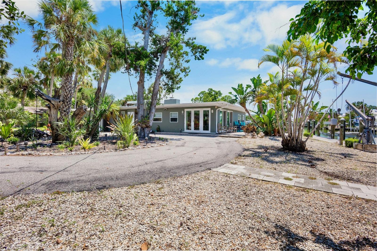 Rare opportunity on prime boating water on Bay Isle. This property offers over one hundred feet of canal frontage, a composite dock, and three boat lifts, ensuring seamless access to the water with no bridges to the intracoastal and Robert's Bay.
The location is perfectly situated between Siesta Key and Downtown Sarasota, allowing you to spend mornings at the beach and enjoy evenings exploring restaurants and cultural events.
This property is zoned for mixed-use multi-family and spans just under half an acre. It presents an incredible chance to reimagine your new family waterfront compound, with ample room for a pool and space for everyone. Additionally, there's an updated two-bedroom, two-bath cottage on-site, perfect for living in while you oversee your transformation. The possibilities are endless!