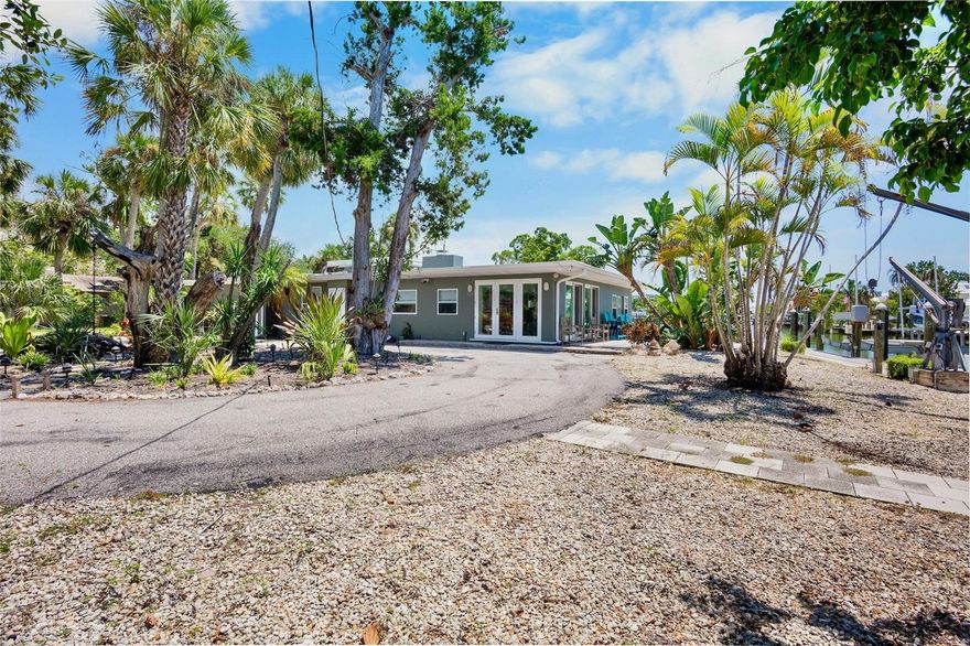 Rare opportunity on prime boating water on Bay Isle. This property offers over one hundred feet of canal frontage, a composite dock, and three boat lifts (16,000#,8000# & 4500#) ensuring seamless access to the water with no bridges to the intracoastal and Robert's Bay.
The location is perfectly situated between Siesta Key and Downtown Sarasota, allowing you to spend mornings at the beach and enjoy evenings exploring restaurants and cultural events.
This property is zoned for mixed-use multi-family and spans just under half an acre. It presents an incredible chance to reimagine your new family waterfront compound, with ample room for a pool and space for everyone. Additionally, there's an updated two-bedroom, two-bath cottage on-site, perfect for living in while you oversee your transformation. The possibilities are endless!