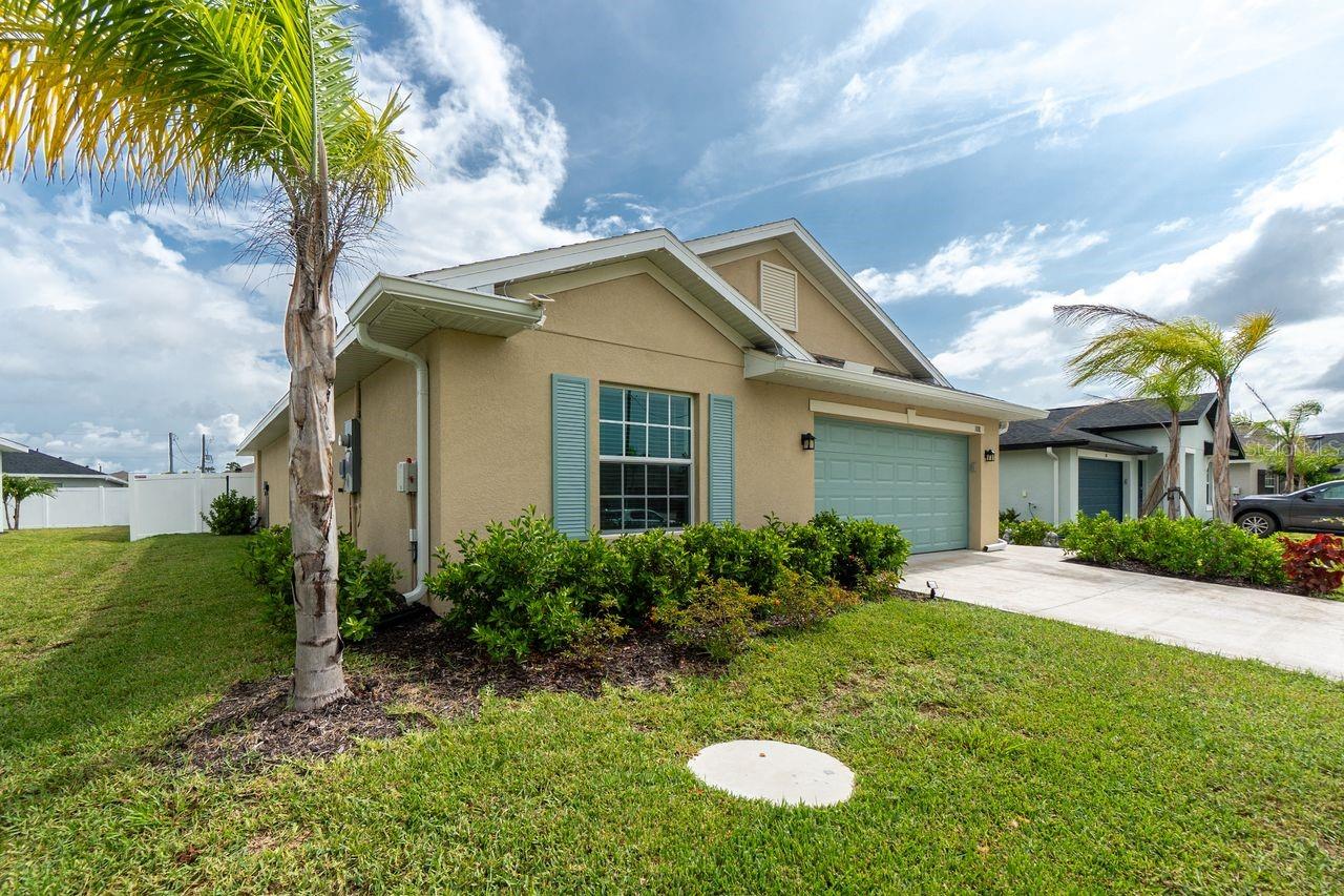 Stunning 2024-Built Home in Beautiful Rotonda Lakes! Home WITH OVER $29,000.00 IN UPGRADES ...
Welcome to your dream home, located just minutes from the pristine shores of Boca Grande Island and close to shopping, dining, and recreation. This meticulously maintained 4-bedroom, 2-bathroom home offers a thoughtful split-bedroom layout, with guest bedrooms on one side and a private owner's suite on the other—ideal for comfort and privacy.
Step inside to a spacious open-concept living area, freshly painted and accented by an electric fireplace with built-in shelving that conveys with the home. The kitchen is a chef’s delight, featuring a large island, new under-cabinet lighting, upgraded spice rack, and a walk-in pantry with custom shelving—perfect for meal prep and entertaining.
The oversized primary suite includes a walk-in closet with a custom closet system, and the en-suite bathroom boasts dual vanities, over-the-toilet cabinetry, and an upgraded exhaust fan with integrated lighting and a Bluetooth speaker.
Enjoy year-round Florida living with a brand-new $14,000 covered lanai featuring a ceiling fan and upgraded lighting—ideal for relaxing or entertaining. The fully fenced backyard ($7,000 upgrade) offers a secure space for pets to play. The home also features a screened front entry with upgraded lighting and a glass front door, allowing natural light and a refreshing cross breeze from front to back. The home also has a low-pressure sewer system that is maintained by Charlotte County.
Additional highlights include:
• Hurricane windows and doors to provide peace of mind
• 20x21 2-Car garage with Insulated door with exterior solar lighting
• Floored attic with lighting and pull-down ladder
• All new ceiling fans throughout
• Beautiful soffit lighting that highlights the home’s curb appeal
• Community amenities include a brand-new covered pavilion—perfect for lunch, reading, or gathering with family and friends.
This home offers the perfect blend of modern comfort, thoughtful upgrades, and Florida lifestyle. Don’t miss your chance to make it yours!