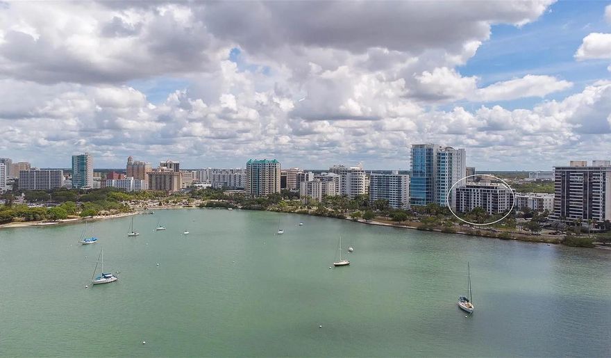 DOWNTOWN BAYFRONT !! Experience the best of downtown Sarasota living in this stunning 2-bedroom, 2-bath corner residence at Essex House, perfectly positioned on Sarasota Bay. This rare unit offers breathtaking, unobstructed panoramic water views through floor-to-ceiling hurricane-resistant windows and one of the few downtown condos with no future development to block your scenery. Just steps from the bay, you'll enjoy effortless access to art galleries, charming coffee shops, top-rated restaurants, Bayfront Park, Marina Jack, Selby Gardens, Burns Court Cinema, Main Street, and more. Inside, the home features an updated kitchen with marble backsplash and stone countertops, beautifully renovated bathrooms with marble-tiled showers, and a spacious primary suite with an upgraded walk-in closet. Step onto your west-facing balcony to savor spectacular sunsets shimmering over the bay. Resort-style amenities include a social room, heated pool, fitness center, outdoor kitchen and gazebo, plus covered assigned parking offering the perfect blend of luxury, lifestyle, and location in the heart of Sarasota.