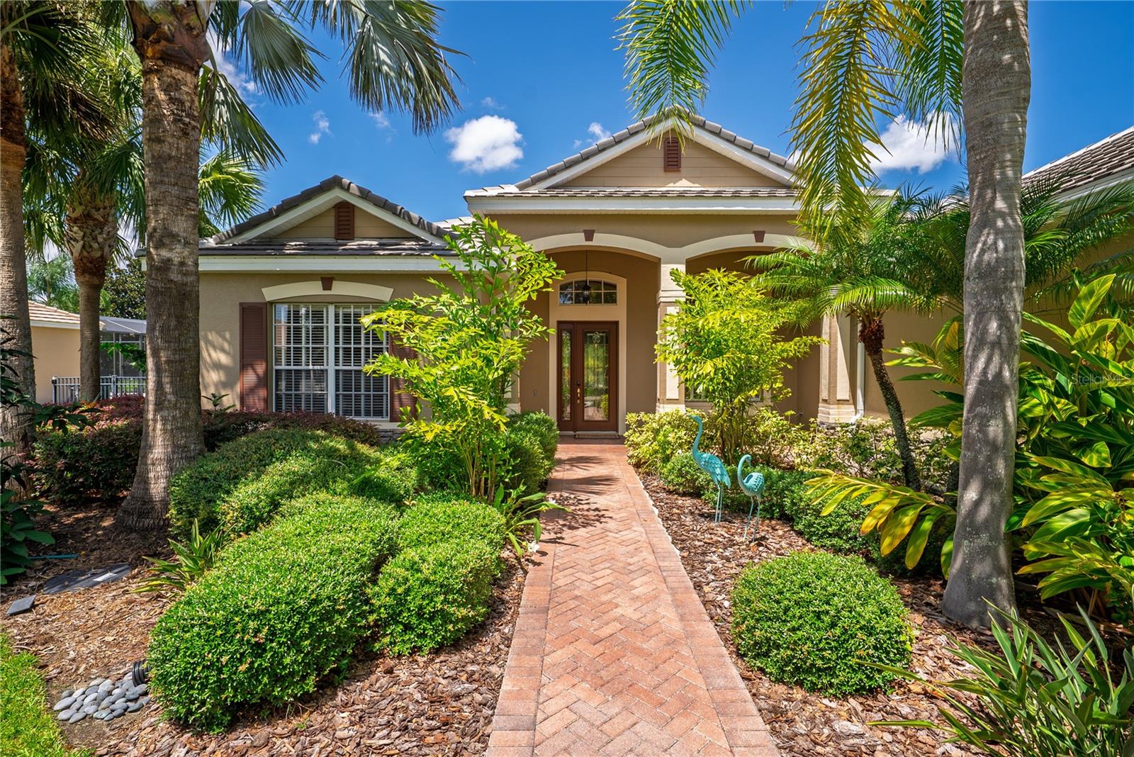 A Luxurious Retreat in Loch Leven's Hidden Paradise! Custom pool home ~ 4 bed/3 bath, plus an office/den/hobby room and oversized 3-car garage on a serene Cul-de-sac and lake access. Come home to a place where tranquility meets sophistication—where every detail whispers comfort and every space tells a story of thoughtful living. This isn't just a house; it's a carefully curated lifestyle nestled in the heart of an exclusive gated community. This home combines elegance, comfort, and scenic surroundings on a 0.45-acre lot with picturesque pond and nature views. The residence features high coffered ceilings, creating an atmosphere of grandeur and spaciousness.
The versatile floor plan is suited for both daily living and entertaining. The formal dining room and spacious living room create an impressive entrance, both extending to the family room - complete with a cozy fireplace - providing a welcoming space for relaxation and connection to the heart of all gatherings...the gourmet kitchen! All-inclusive with high-end appliances, including a gas cooktop, wall oven, prep island with built-in wine cooler, and dine-in area. The split-bedroom design with three distinct alcoves offers all 3 bedrooms with bathroom access, ensuring privacy and peace for everyone. The spacious primary bedroom has a cozy sitting area and the in-home spa Bath is complete with dual sink vanities, a walk-in tiled shower, jetted soaking tub, and two large walk-in closets with custom closet systems.
French Doors from the primary bedroom (and the Family Room) allow seamless movement to the outdoor screened lanai with an enclosed Pool & Hot Tub. Additionally, the home offers an office area accessible from the foyer, a sizable laundry room with built-in cabinetry, ample storage closets, and a gym space.
OUTDOOR AMENITIES: Fully Enclosed Screened in ‘heated’ saltwater pool & spa with beautiful water features, surrounded by a generous yard featuring palms, fruit trees (Tangerine, Loquat, and Banana) and tropical landscaping. Quiet and Private, with no neighbors on two sides, bordered by protected trees and a natural pond—ideal for nature and bird enthusiasts. PERKS: Private lot backs up to a Protected Water Conservation Area. Notably, wide doorways make this home wonderfully accessible.
UPDATES: (2023-Current): oven/microwave, range hood, dishwasher, A/C, pool heater, washer and dryer.
HOA/COMMUNITY: Residents of this premier gated community enjoy lake access via a private boat ramp and new dock, suitable for boating, fishing, kayaking, or appreciating the tranquil setting. Amenities include Tennis/Pickleball Courts, Playground, Picnic Pavilion, Basketball Courts, Conservation Area, and RV/Boat Storage. Loch Leven centers around a 169-acre spring-fed lake and is conveniently situated minutes from Shopping, Boutiques, Fine Dining, Cafés, Art Galleries, Festivals, and Major Highways (Hwy 441, SR46, and FL Toll Roads) offering easy travel throughout Central Florida.
PRIVATE TOUR INVITE: This isn't just a house; it’s a home and an invitation to embrace a lifestyle of luxury and nature in a resort-like setting that reflects your most cherished dreams... private, secure and distinguished. Call today to schedule your private tour!