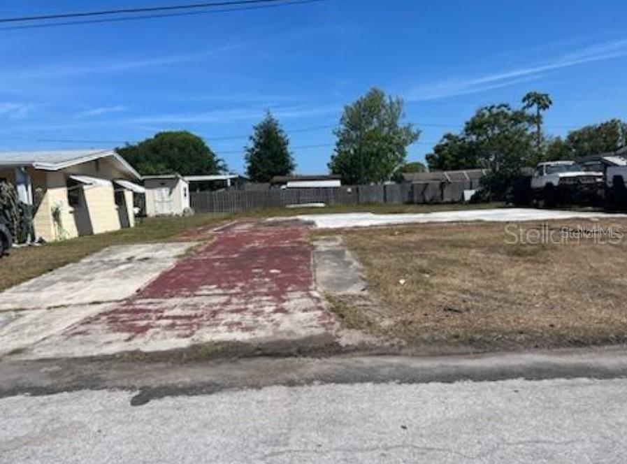 Explore the possibilities with this prime vacant lot in the Grove Park neighborhood of New Port Richey. Tucked away on a quiet, paved street, this property offers a rare chance to build in a well - established area with NO HOA restrictions. Enjoy close proximity to local shops, restaurants, medical centers, and the scenic Gulf Coast. With convenient access to major roadways and a short drive to the Tampa Airport, this location blends everyday ease with coastal charm. Whether you're planning a custom build or seeking a smart investment.