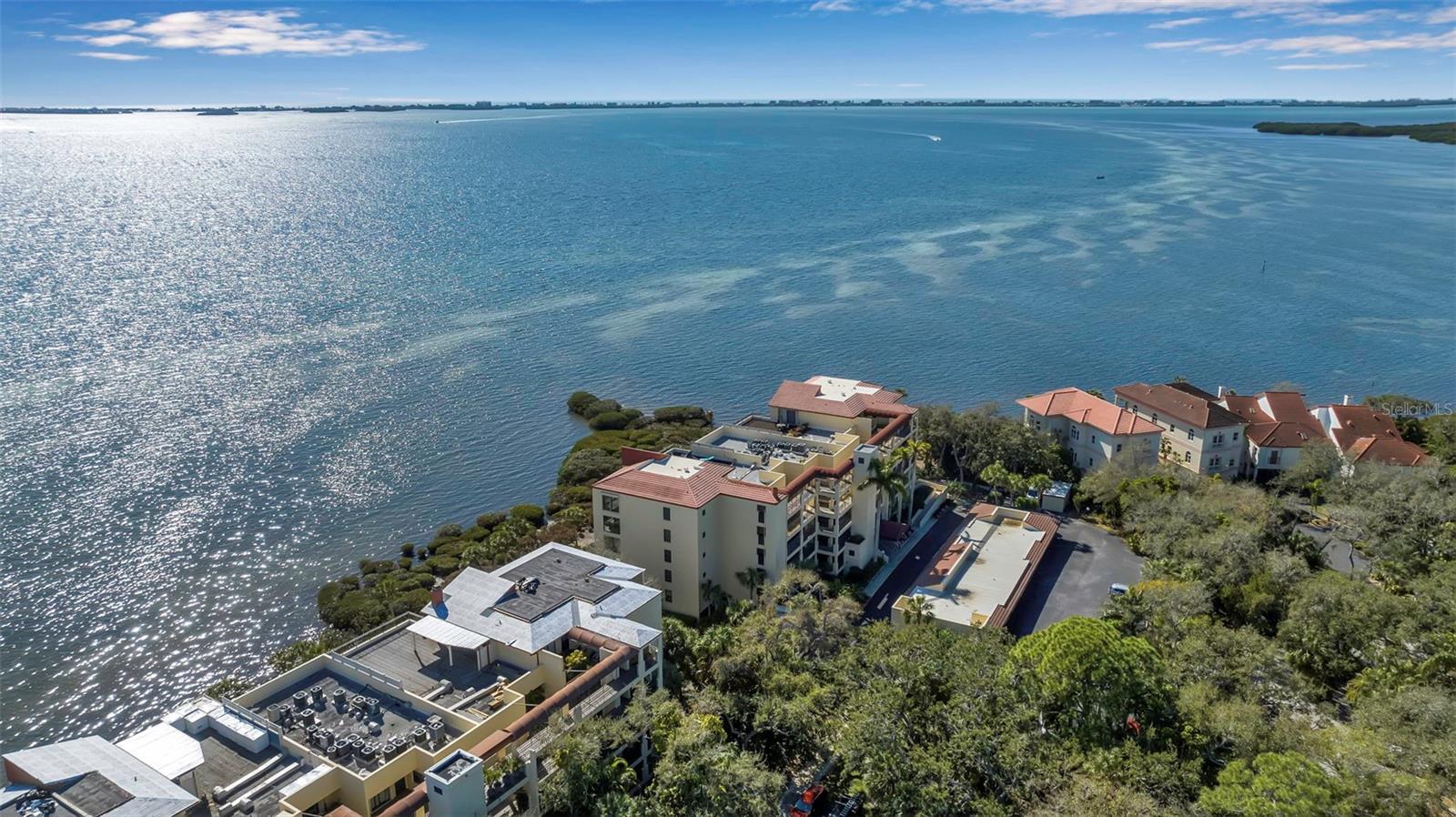 Bayfront Beauty for Lease – Breathtaking Views & Unforgettable Sunsets! Live the dream with this rare opportunity to Lease a waterfront condo on Sarasota Bay! Enjoy stunning views and glowing sunsets every evening from the comfort of your own home in this spacious and well-appointed residence. This beautifully maintained condo offers two large bedrooms, each with walk-in closets, plus a versatile bonus room featuring a built-in Murphy bed—perfect as a third sleeping area, guest room, or home office. The open living and dining layout is ideal for both relaxing and entertaining, while the kitchen includes a pantry and extra space for casual dining. Additional features include new vinyl plank flooring, two full bathrooms, an indoor laundry area with full-size washer and dryer, and ample storage throughout. Convenient elevator access is located right outside your private entrance. You'll also enjoy an assigned covered parking space, additional guest parking, and a personal storage closet near your parking spot. Community amenities include a refreshing pool and spa for your enjoyment. Located just minutes from IMG Sports Academy, golf courses, and approximately 8 miles from Gulf beaches, this rental combines comfort, convenience, and a spectacular setting. Now available—schedule your private tour and secure this waterfront gem before it’s gone!