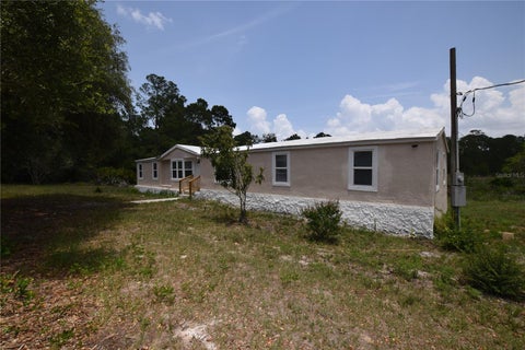 Photo of 40404 Holly Branch Road, Eustis, FL 32736 (MLS # O6446775)
