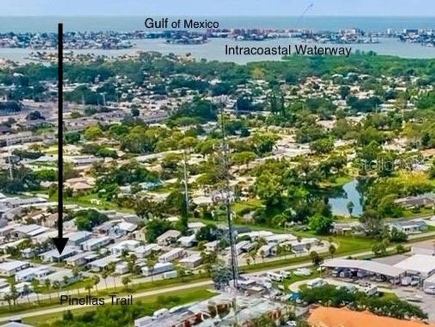 Here are some of the virtues of this property:  TURNKEY, you’ll have a difficult time finding anything that it needs; not just FURNISHED, but it’s furnished tastefully/comfortably/creatively; ALL ages accepted; NO lot rent, it’s a cooperative; LOW monthly homeowner’s association, $160; NOT in a flood zone; 2 house PETS are allowed under 60 pounds.  ****LOCATION!! This community is at the epicenter of convenience - just look at the notes on the photos to see exact mileages to the places you need: beaches, parks, Bay Pines Veteran’s Hospital. ***Commuting is also a breeze with quick access to downtown St. Petersburg, Tampa, and both major airports. PRIVATE access via 3 locked gates to the 75-mile Pinellas Trail Loop that runs from Tarpon Springs south to St. Petersburg. *** In the past 4 years work has been done to bring both bathrooms and the kitchen into the modern era. Kitchen: New gas stove, dishwasher, microwave, refrigerator, cabinets, deep 1-bowl stainless steel sink * New gas hot water heater * Throughout: UPdated light fixtures/ceiling fans with LED bulbs, faucets, laminate flooring * barn doors on Master/Primary bedroom and Hall/Guest bathroom * Both Bathrooms: UPdated lavatories, vanity’s, stall shower inserts * Doggie door and fenced Dog Run. *** H.O.A. Dues cover on-site manager, water, sewer, yard maintenance, clubhouse, library, laundry. ***   Whether it's your primary home or second home, this TURN KEY & FURNISHED home is waiting just for you!