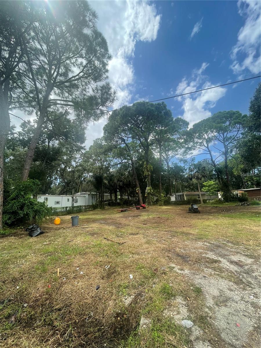 Discover the perfect location for your new home in the desirable community of Nokomis. This cleared lot is ready for building and offers the convenience of being on city water. Enjoy nearby upscale buildings and amenities, just minutes from pristine beaches like Nokomis Beach (2.7 miles) and Venice Beach (3.2 miles). The famous Legacy Trail bike/walk path, charming Downtown Venice, and I-75 are easily accessible. Plus, you're only 5 minutes from Publix, the hospital, and essential services. This unique zoning permits either a mobile home or single-family residence, providing flexibility for your ultimate plans