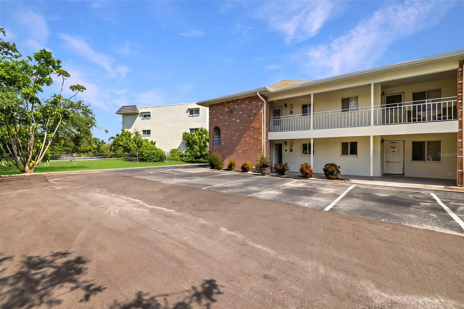 RARE END-UNIT in the desirable LAKE OVERLOOK community, offering EXTRA PRIVACY, tons of NATURAL LIGHT, and serene COURTYARD VIEWS. This spacious 2-BEDROOM, 2-BATH, SECOND-FLOOR condo spans 1,145 square feet and features an UPDATED PRIMARY BATHROOM with a WALK-IN SHOWER, GRANITE COUNTERTOPS, and a VERSATILE FLORIDA ROOM perfect for work or relaxation.
A true standout in the community, this unit includes a WASHER AND DRYER INSIDE the unit — a RARE feature in Lake Overlook — along with access to a COMMUNITY LAUNDRY ROOM for added convenience. You'll also have your OWN EXTERNAL STORAGE UNIT located in the center of the building for all your extras.
This unit was NOT AFFECTED by any of the recent storm-related flooding. Only the first-floor units were impacted, and their FULL RESTORATION is currently underway — FULLY FUNDED by the condo association’s insurance coverage.
Lake Overlook offers a FULL SUITE OF AMENITIES, including a HEATED POOL, clubhouse with BILLIARDS AND PING PONG, FISHING DOCK, BBQ GRILLS, and SCENIC WALKING PATHS. The HOA FEE INCLUDES HIGH-SPEED INTERNET, 150+ CABLE CHANNELS with STREAMING APPS like DISNEY+ and HBO MAX, plus WATER, SEWER, TRASH, EXTERIOR MAINTENANCE, POOL CARE, and BUILDING INSURANCE.
All of this is located in the sought-after SHORE ACRES neighborhood, just minutes from DOWNTOWN ST. PETERSBURG, 4TH STREET shopping and dining, I-275, GANDY BRIDGE, and area BEACHES. Zoned for A-RATED SHORE ACRES ELEMENTARY.
Whether you're looking for a PRIMARY RESIDENCE, VACATION ESCAPE, or a TURNKEY INVESTMENT PROPERTY, this rarely available END-UNIT offers COMFORT, CONVENIENCE, and VALUE in one of St. Pete’s most welcoming communities.