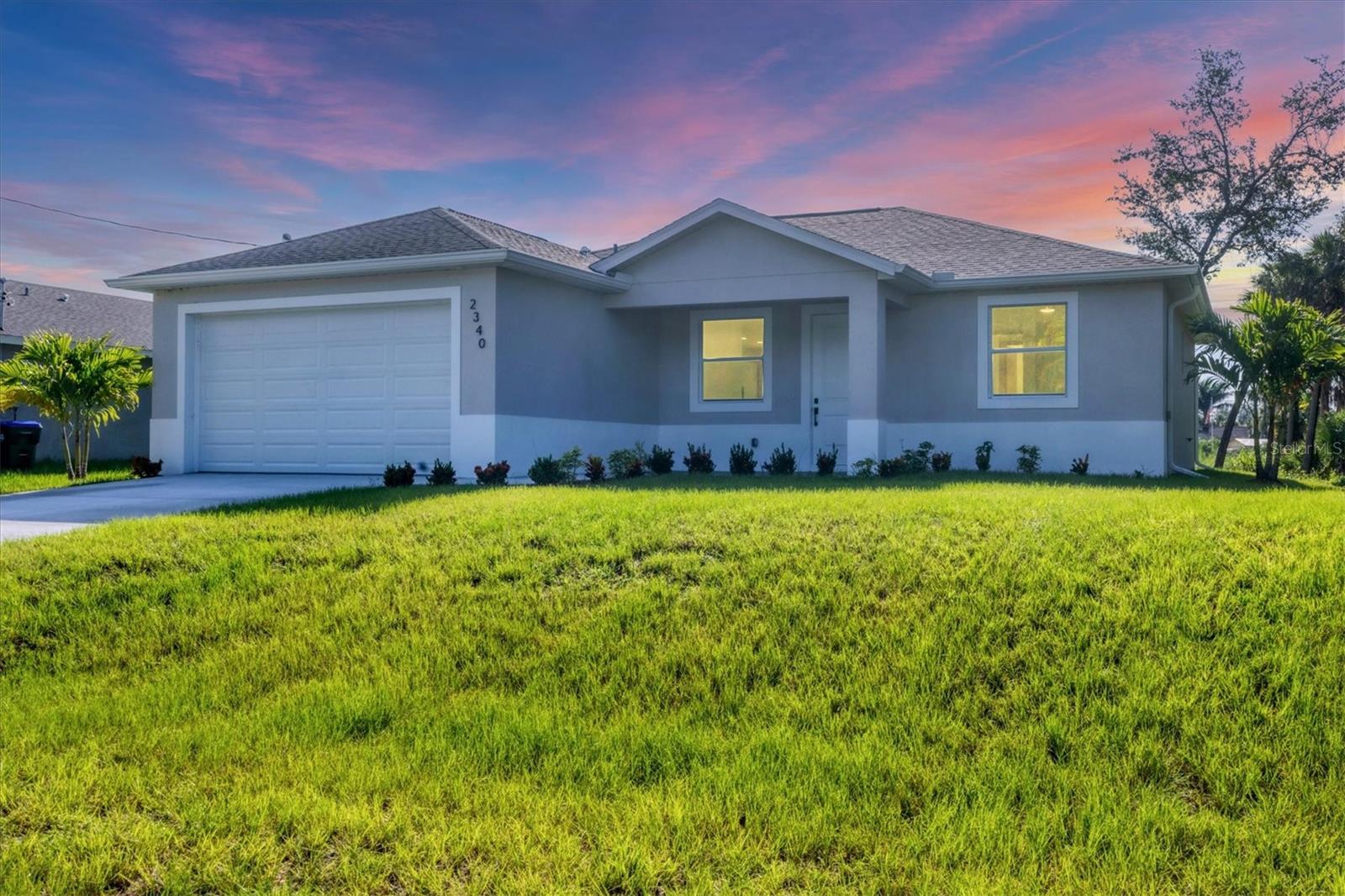 Beautiful New Construction Home – Available for Purchase or Rent. This brand-new 3-bedroom, 2-bath home offers modern design, stylish upgrades, and thoughtful details throughout. Whether you're looking to buy or lease, this home stands out with its clean lines, open layout, and move-in ready convenience. From the moment you arrive, you’ll be greeted by well-maintained landscaping and a striking 8-foot front door that gives the home a warm, inviting presence. Step inside to soaring 9’4” ceilings and large impact-rated windows that flood the space with natural light. The open floor plan leads into a designer kitchen featuring a massive quartz island, sleek European-style cabinetry, perfect for both everyday living and entertaining. Oversized 8-foot sliding glass doors open to a spacious rear patio, ideal for outdoor dining, gatherings, or just relaxing in the privacy of your backyard. The home also features a full gutter system and an irrigation setup to keep the lawn and landscaping in top shape. The primary suite feels like a private retreat, offering a spa-like bathroom with a freestanding soaking tub, a frameless glass shower, and elegant floor-to-ceiling tilework. The large walk-in closet adds even more functionality and storage. Two additional bedrooms offer generous space, each with ceiling fans and ample closet room. You’ll also find a separate laundry room, a two-car garage, and a wide driveway for extra parking. Located just a short drive from shopping, dining, and everyday conveniences, this home offers comfort, style, and flexibility. Also available for rent at $2,400/month plus a $2,400 security deposit, application fee, and lease preparation fee.