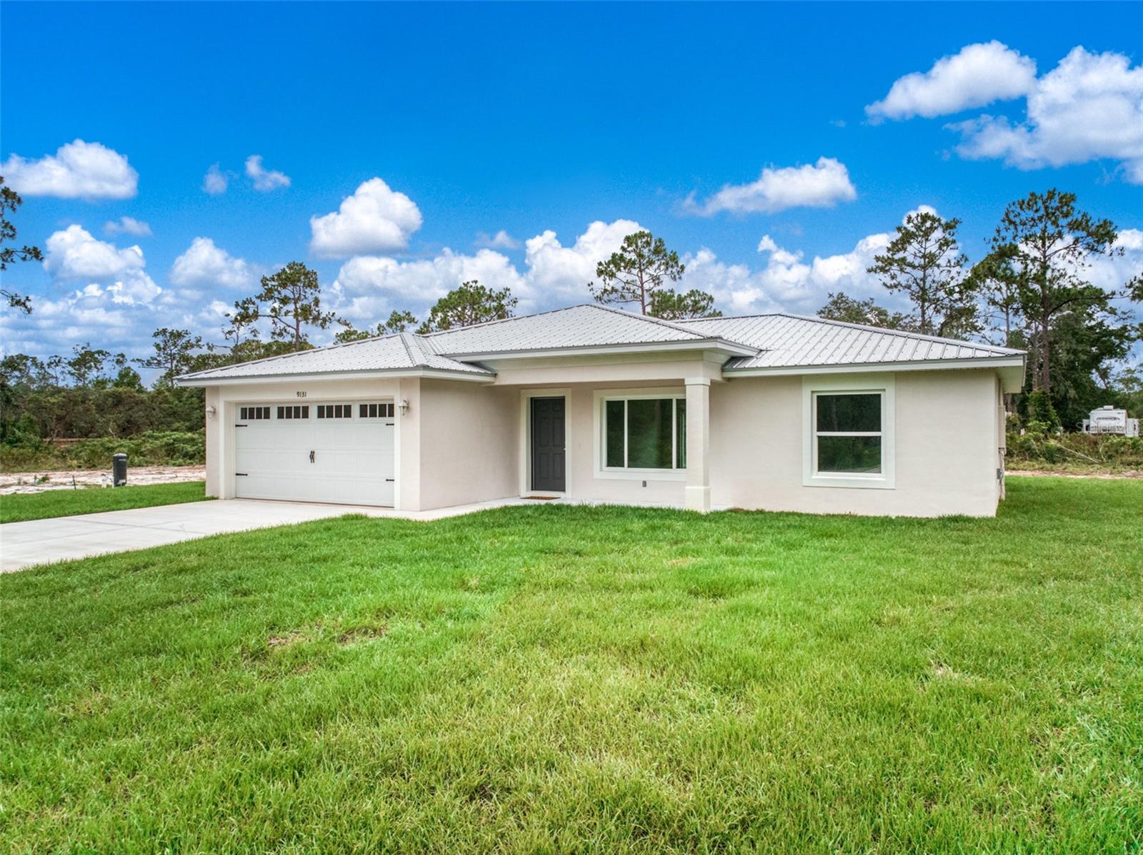 New Construction | 3 Bed | 2 Bath | 2-Car Garage | 2.32 Acres | No HOA | Metal Roof
Brand new, beautifully crafted 3-bedroom, 2-bath home on 2.32 secluded acres in the heart of Sebring. This thoughtfully designed open-concept layout features high-end appliances, premium finishes, and a metal roof—the gold standard for Florida living. Built for energy efficiency, durability, and low maintenance, this is affordable luxury at its best.
Enjoy the long winding driveway, surrounded by mature trees and privacy, with direct access to paved roads—a rare combination for acreage living. With no HOA, there’s plenty of room to build a detached shop, barn, or RV garage.
Properties like this—new construction, acreage, and prime central location—are incredibly rare. Don’t miss this unique opportunity to own your piece of peace and quiet, just minutes from town.