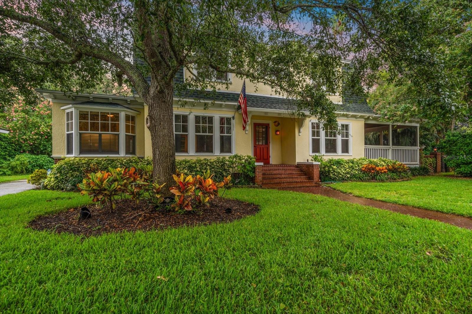 Charming 1926 Dunedin Gem – Easy golf cart ride to Main Street & Edgewater Drive Park.
Located less than a mile from vibrant Downtown Dunedin, and only a block and a half from scenic Edgewater Drive Park, this beautifully preserved 1926 two-story home blends historic charm with modern convenience. Meticulously maintained by the same owner for over 50 years, the home features original architectural details and character throughout, complemented by a tastefully updated kitchen.
With 3 bedrooms and a dedicated office space—complete with its own private entrance—this home offers both comfort and flexibility. The spacious screened porch off the dining room is perfect for casual entertaining or relaxing with a good book.
Set on a lush, oversized lot, the property is a gardener’s paradise with winding brick pathways, mature trees, and a canopy of greenery. A detached oversized 2-car garage, built in 2019, offers ample storage and workspace. Additional features include natural gas for the hot water heater and an unbeatable location in one of Dunedin’s most desirable neighborhoods.
Don’t miss the opportunity to own a piece of Dunedin history just moments from the waterfront, dining, and shopping!