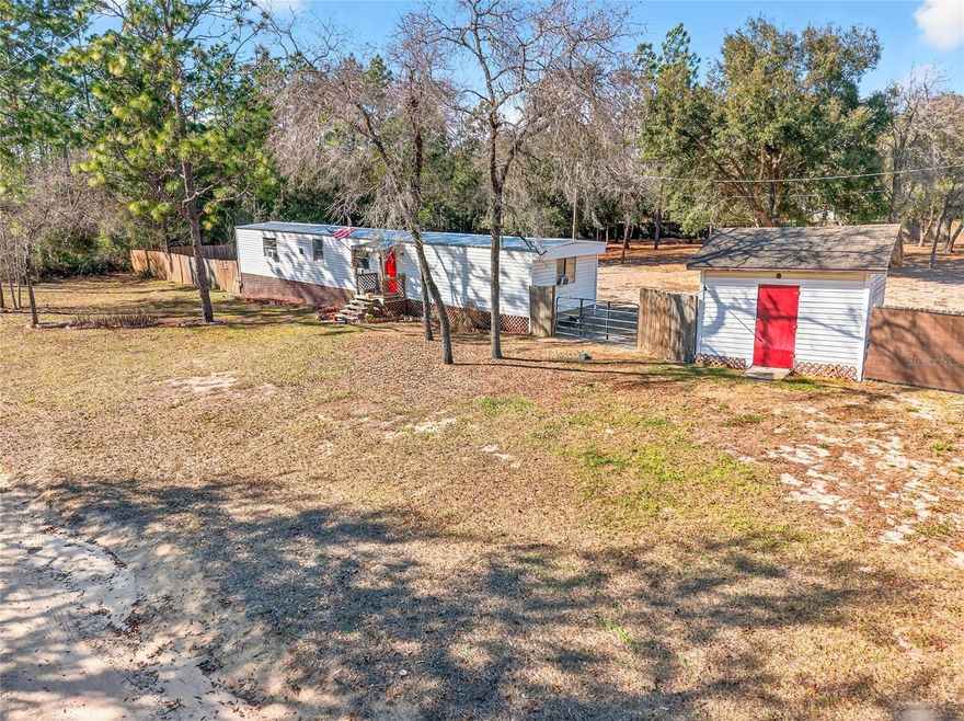 1 ACRE, PRIVACY PERIMETER FENCED, CORNER LOT WITH NO HOA! UPDATED 3/2 , NO CARPET, INSIDE LAUNDRY ROOM, SMALL STORAGE BUILDING, ON A DIRT ROAD, WELL AND SEPTIC, HAS WINDOW UNITS, NO CARPET, HVAC ON SITE BUT NEEDS REPAIR, CASH ONLY SALE!!
