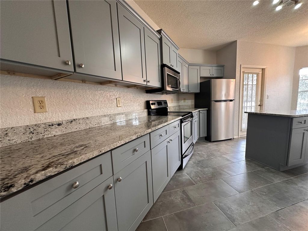 Photo of 150 Villa Di Este Terrace #212, Lake Mary, FL 32746 (MLS # O6392314)