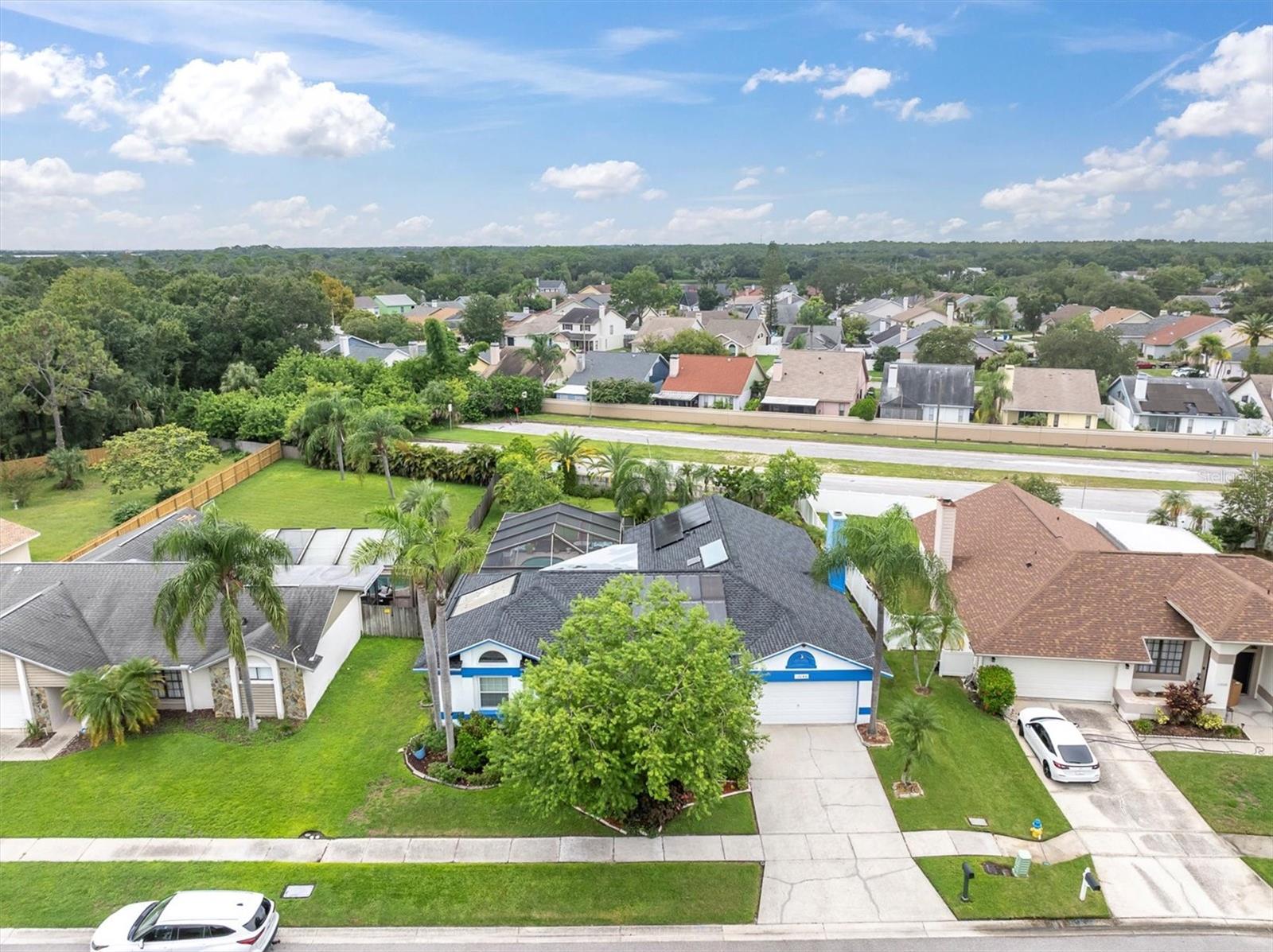 Welcome to this beautifully updated 4-bedroom, 2-bath, 2-car garage pool home in the highly sought-after Countryway/Westchase area. Situated on a large .24-acre lot, this home features a brand-new roof, solar panels, and a sparkling screened pool perfect for Florida living. Inside, the gourmet kitchen is a true centerpiece with a spacious island, sleek cabinetry, quartz countertops, and stainless-steel appliances, opening to the main living areas for seamless entertaining. The primary suite offers a tastefully updated bath, while the thoughtful layout provides comfort and functionality throughout. Additional highlights include modern finishes, fresh updates, and a fenced backyard with plenty of room to relax or play. Located in a fantastic neighborhood with top-rated schools, parks, and golf nearby, plus easy access to shopping, dining, and Tampa Bay amenities.