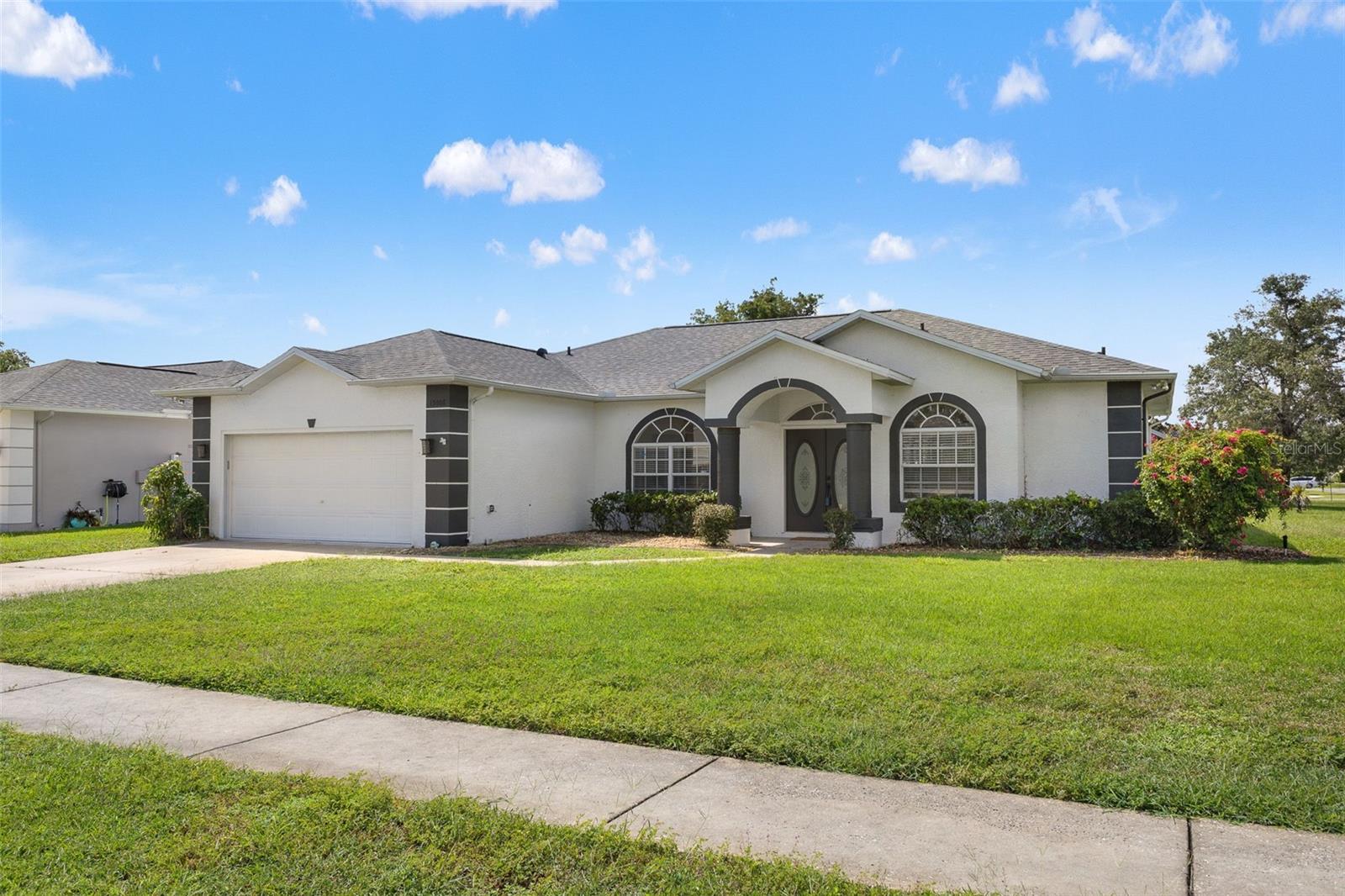 Beautifully renovated 3 bedroom, 2 bathroom pool home with 2-car garage on a desirable corner lot in Spring Hill/Brooksville. This move-in ready property has a brand-new roof with transferable warranty and extensive upgrades throughout. Inside you’ll find new flooring, modern fixtures, fresh paint, and an updated kitchen with brand-new quartz countertops, stainless steel appliances, and stylish finishes. The spacious primary suite features a spa-like bathroom with a stand-alone soaking tub and modern walk-in shower, creating a true retreat. The open layout fills the home with natural light. Step outside and enjoy the Florida lifestyle with a sparkling screened pool and newly replaced pool cage screens—perfect for entertaining or relaxing. Conveniently located near shopping, dining, and major highways, this home offers peace of mind, comfort, and style—all in one package.