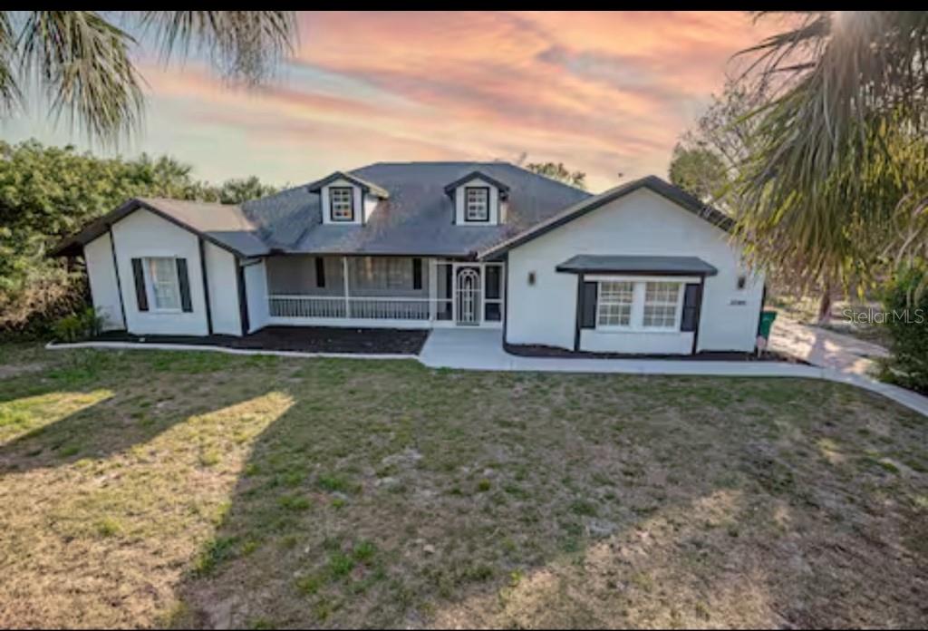Perfect opportunity to own this traditional style water front Fully renovated home with 4 bedrooms and 3 bathrooms situated on an over-sized double corner lot. With 3,059 square feet of living space this spacious home has perfect spaces for all including master suite, family room, living room dining room and large lanai area with outdoor kitchen. Home is open and bright with LEVEL 5 FINISHED WALL'S & HIGH CEILINGS! Custom white shaker Kitchen area is open to the family room on one side and dining room on the other and features abundance of counter and cabinet space. Master room French doors leading out to the lanai area and a master bath with his/her vanity area, large free standing tub, Large shower and 2 walk-in closets. Family and friends will appreciate the guest suit with three guest bedrooms along with full guest bath tucked away from the living area. This water front property has boat ramp and with dock and access up the Waterway to the Myakka River, Charlotte Harbor and the Gulf. Home also has circular driveway, sheds in the backyard for storage. Situated on a quiet street you will enjoy the tranquil setting and the mature landscaping of the oversized . 73 acres. Large lot open for opportunities, build a shop, or large pool!