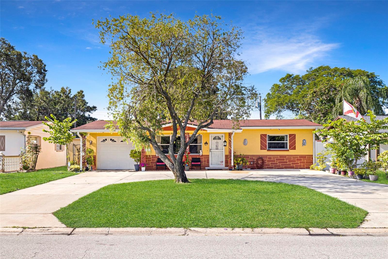 Step into a home that’s been lovingly cared for by the SAME OWNER for OVER 25 YEARS, offering a WARM, WELCOMING feel from the moment you pull up. Sitting on a SPACIOUS LOT in CENTRAL PINELLAS PARK, this SOLID BLOCK 2-BEDROOM, 1-BATH home features a CIRCULAR DRIVEWAY, 1-CAR GARAGE, and an INCREDIBLE BACKYARD setup you don’t always find in this PRICE RANGE.
Inside, you’ll find CHARMING ORIGINAL TOUCHES like SCALLOPED KITCHEN CABINETRY alongside KEY UPDATES, including a 2017 ROOF, BRAND NEW 2024 WATER HEATER AND WATER SOFTENER, and a SOLAR-HEATED SALTWATER POOL — perfect for RELAXING or ENTERTAINING YEAR-ROUND. The OPEN LIVING AND DINING SPACES flow easily, giving you the chance to MOVE RIGHT IN or UPDATE TO YOUR TASTE over time.
Whether you’re a FIRST-TIME BUYER looking for something with CHARACTER, or an INVESTOR seeking a WELL-MAINTAINED PROPERTY WITH GREAT BONES, this home DELIVERS FLEXIBILITY. Plus, you’re just 10–20 MINUTES from GULF BEACHES, DOWNTOWN ST. PETE, or TAMPA.
EASY LIVING, a FANTASTIC OUTDOOR SETUP, and a CENTRAL LOCATION — this one CHECKS ALL THE BOXES.