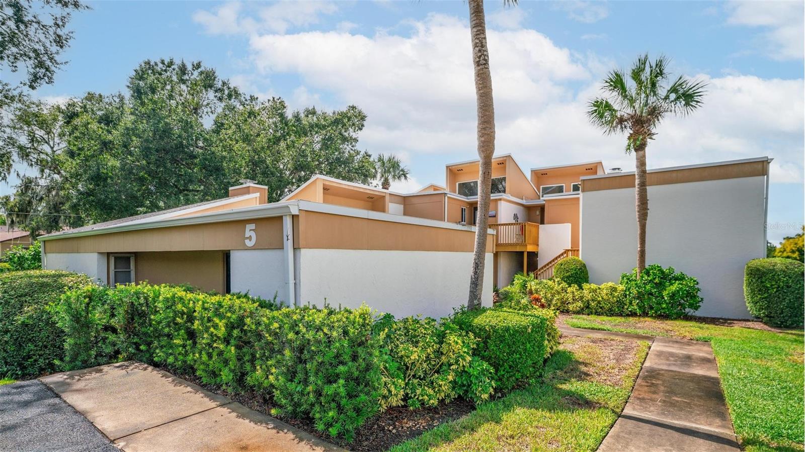 Recently Updated 2BR/2BA Condo Overlooking Pool – Just 1 Mile to Downtown Mount Dora! Welcome home to this beautifully updated condo featuring a prime pool view and a host of modern upgrades! Step inside to find an open living area with soaring ceilings, fresh paint, new flooring, and a cozy refinished fireplace that sets the perfect tone for relaxing or entertaining. The kitchen shines with stainless steel appliances, a breakfast bar, and newer dishwasher and stove, while the 2022 updates include new sliders, doors, and windows for peace of mind. The spacious master suite boasts a large walk-in closet, dual vanities, and a private bath with a step-in shower. The second bedroom is equally inviting, with easy access to the main bathroom featuring a tub/shower combo. A bonus space off the living room offers endless possibilities—ideal for a home office, dining nook, or reading corner. Best of all, the unit comes with its own washer and dryer for ultimate convenience. Step through the new sliders to your private balcony overlooking the sparkling pool, perfect for morning coffee or evening sunsets. Located just about 1 mile from downtown Mount Dora, you’ll enjoy quick access to its famous festivals, charming shops, and dining. Explore nearby Lake Dora and the Chain of Lakes for boating and fishing adventures, or spend weekends at Renninger’s Flea Market. With US 441 close by, commuting and day trips to Orlando, Disney, or the coasts are a breeze. This move-in-ready condo checks all the boxes—modern updates, unbeatable location, and resort-style amenities. Schedule your showing today and see why this should be your next home!