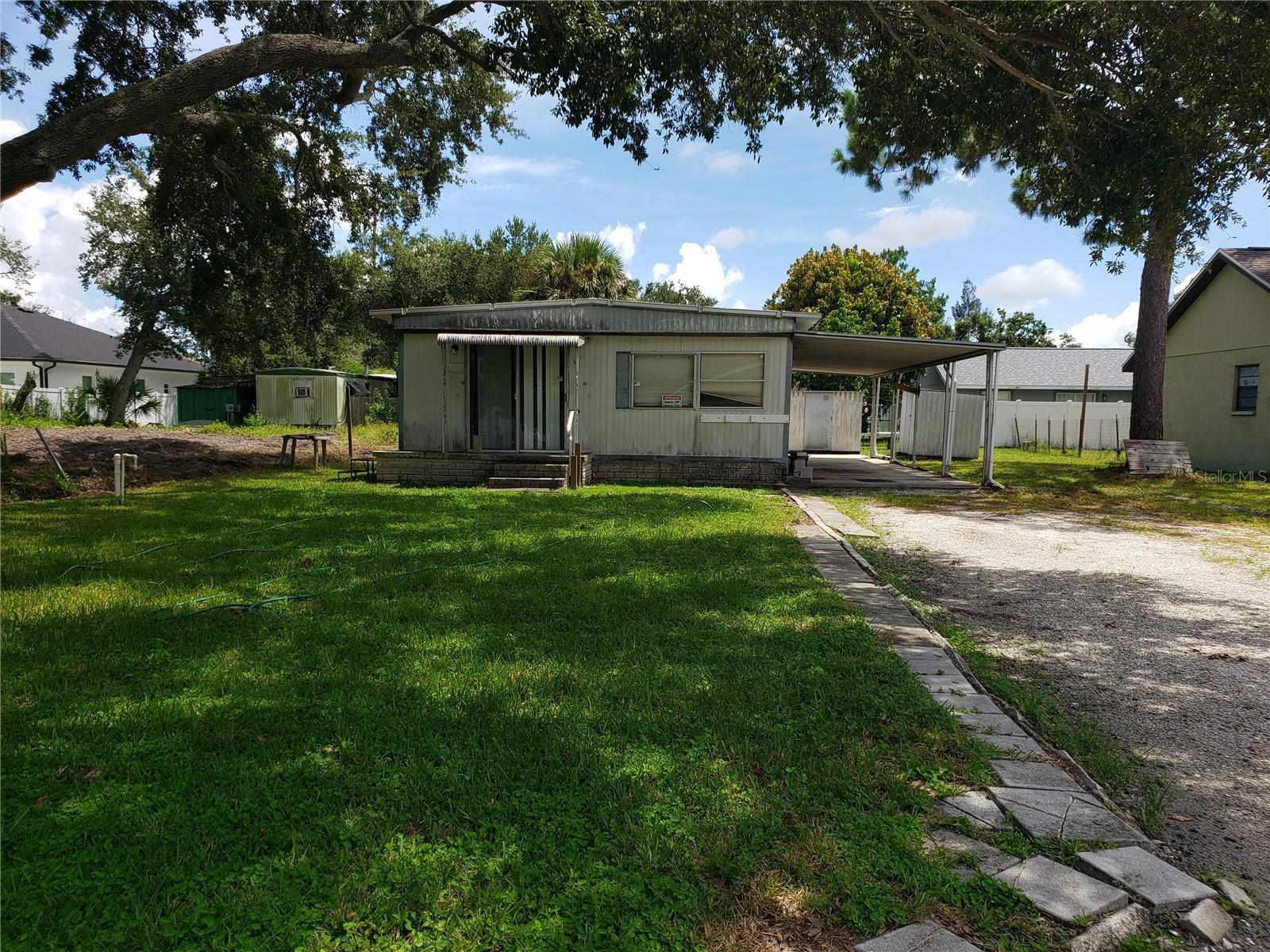 ATTENTION INVESTORS!!! This modular home on ITS OWN LAND in a NON FLOOD ZONE!!!! This home will require some work. Add this to your portfolio as a rental property or for a new construction project. This is a GREAT OPPORTUNITY FOR AN INVESTOR or someone looking to TO BUILD A DREAM HOME WITH MANY HIGH END NEW BUILDS GOING UP ALL AROUND! Great opportunity to build in Pinellas Park. Not finding the right home?? Choose new construction or manufactured home in a fantastic location!