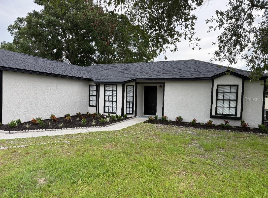 Welcome home to this tastefully remodeled 4 bed 2 bath home. Brand new kitchen with stunning countertops, new appliances & fixtures. Vinyl flooring throughout. Open floor plan to kitchen, living room & dining room. Master suite with a custom double shower & walk in closet! all design tiling & fixtures!!!2 car garage rear screened in porch Brand new roof. MOVE RIGHT IN!