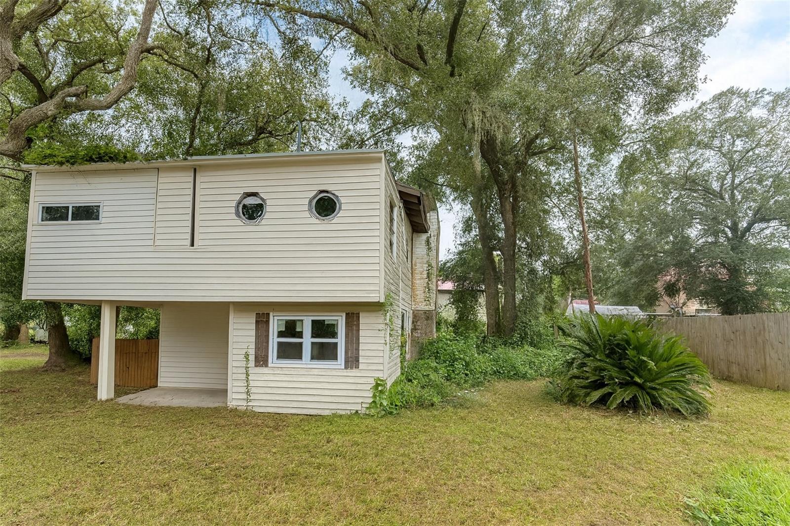 One or more photo(s) has been virtually staged. Welcome to this charming 4-bedroom, 2-bath home nestled on a peaceful lot in Umatilla, FL. Offering 1,460 sq. ft. of living space, this property combines comfort, functionality, and convenience.
Enjoy the outdoors in your oversized yard, ideal for gardening, barbecues, or simply relaxing under the Florida sunshine. With no rear neighbors in sight, you’ll appreciate the privacy and natural surroundings.
Located just minutes from the Ocala National Forest and Lake Weir, this home offers quick access to fishing, boating, hiking, and countless outdoor adventures. You’re also within a short drive to downtown Umatilla, local shops, and restaurants, with easy access to Ocala and The Villages. Handyman’s dream! With some repairs and upgrades, this property can shine again. Ideal for investors or DIY buyers