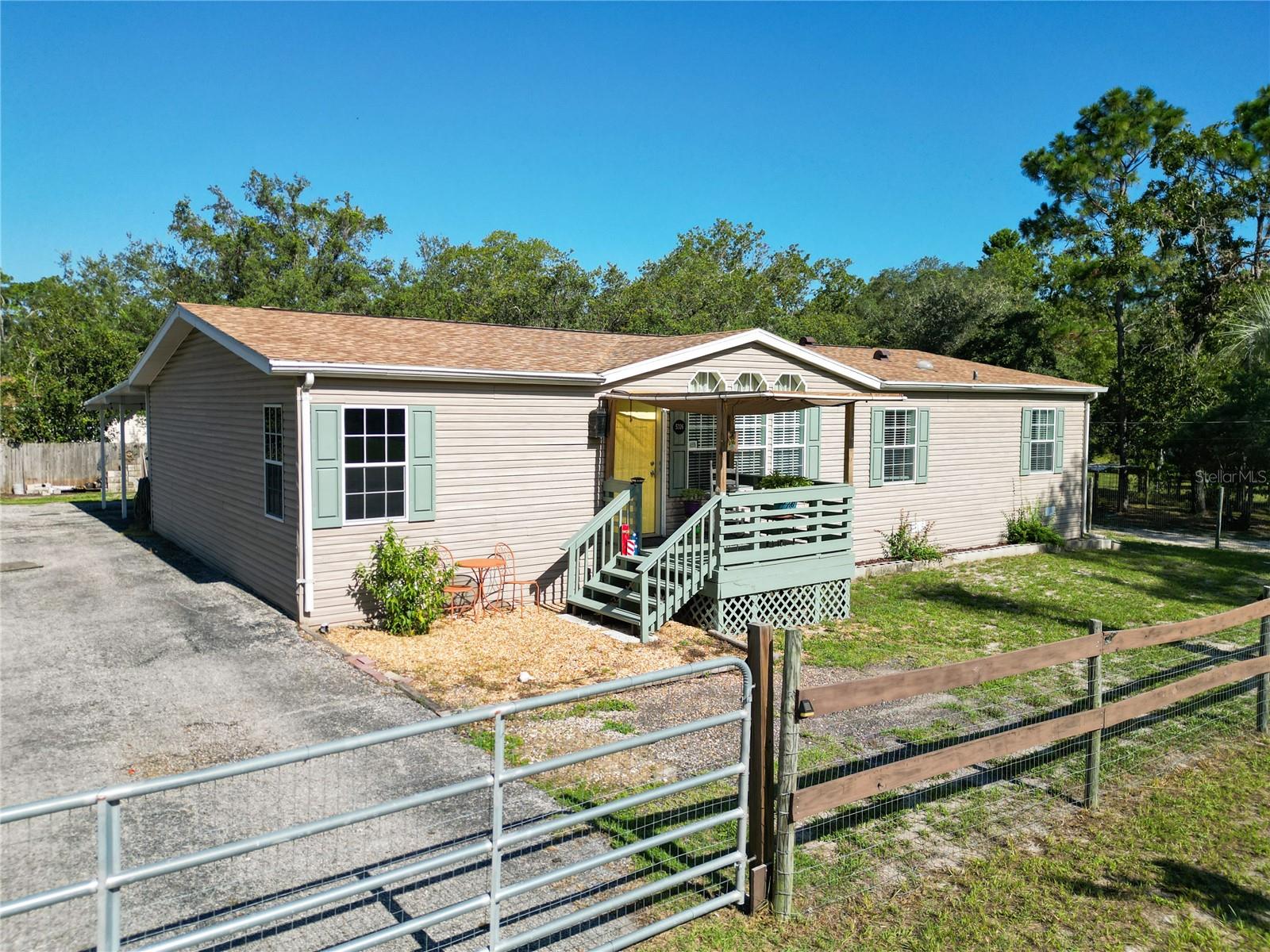 PRICED TO SELL! Don’t miss this spacious 3-bedroom, 2-bath home on a private, fully fenced 0.60-acre lot in Homosassa. Recent upgrades include a new HVAC (2024) and new roof (2022). Located in flood zone X - no flood insurance required. Inside, you'll find a bright and inviting layout featuring a master suite with dual sinks, a soaking tub, and separate shower. The home offers both a living room with dining area and a separate den/family room, perfect for flexible living. The large kitchen includes ample cabinet space and a center island. Enjoy the outdoors on the front and back deck porches. Additional features include a multi-car carport, storage shed, chicken coop, and abundant natural light throughout. Just minutes from the Gulf and natural springs, ideal for fishing and Florida fun.
