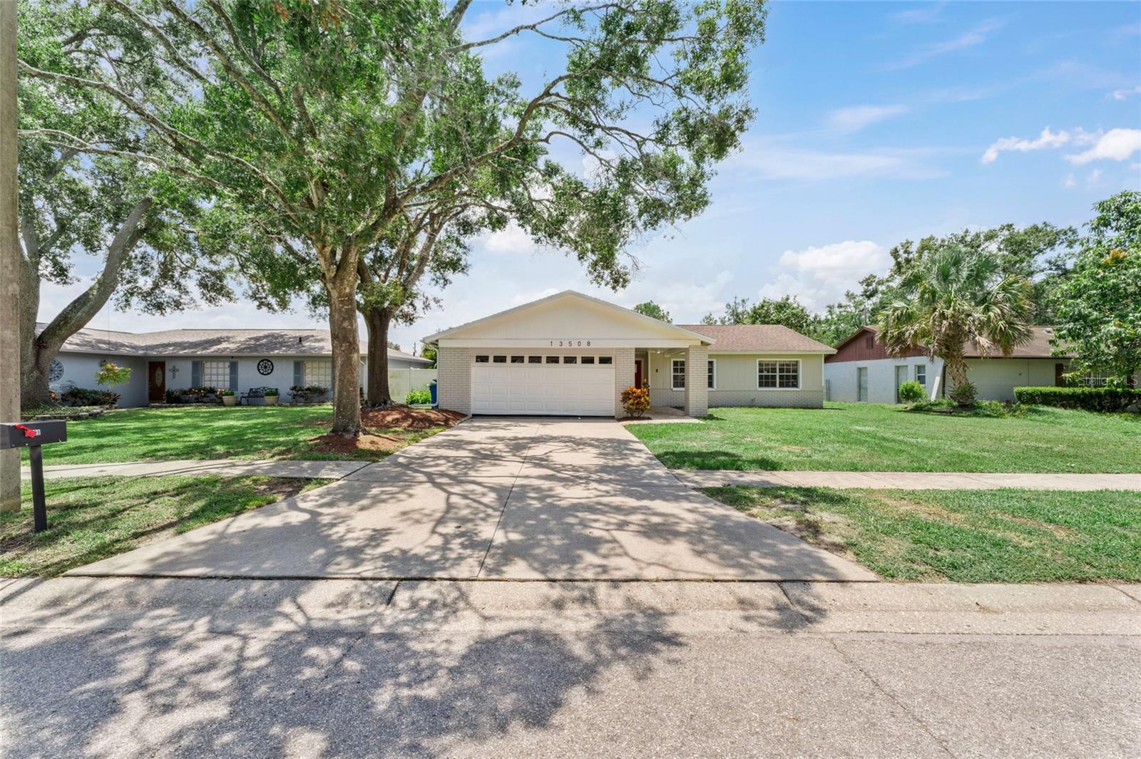 One or more photo(s) has been virtually staged. Move-in ready and beautifully updated, this 3-bedroom, 2-bathroom home with a 2-car garage offers the perfect blend of comfort, style, and convenience! Step inside to a bright open floor plan with gleaming white polished porceline flooring that flows through the main living areas, creating a sleek and sophisticated feel. The central kitchen features granite countertops, stainless steel appliances, and seamlessly connects the separate living and dining areas—ideal for entertaining or everyday living. All three bedrooms are generously sized with engineered hardwood flooring and ample closet space. Enjoy Florida living at its finest on the covered lanai overlooking a gorgeous pool with room to add a tiki bar, fire pit, or additional seating. The spacious garage includes a washer and dryer for added convenience. Located in a desirable New Tampa neighborhood near Lake Magdalene, this home offers quick access to USF, I-275, and all that Tampa has to offer. Don’t miss this one!