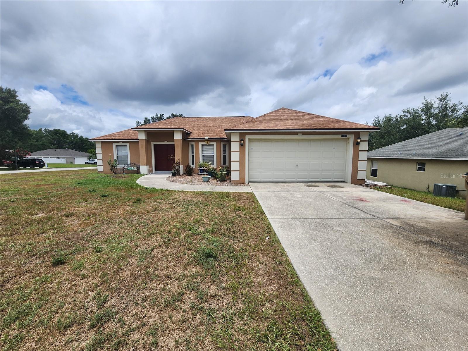 This property has a great open floor plan with nice high ceilings and tile throughout. Enjoy a large corner lot with a long driveway and nice covered patio in the backyard. Neighborhood is small and quiet but close to all major stores. Come apply today!