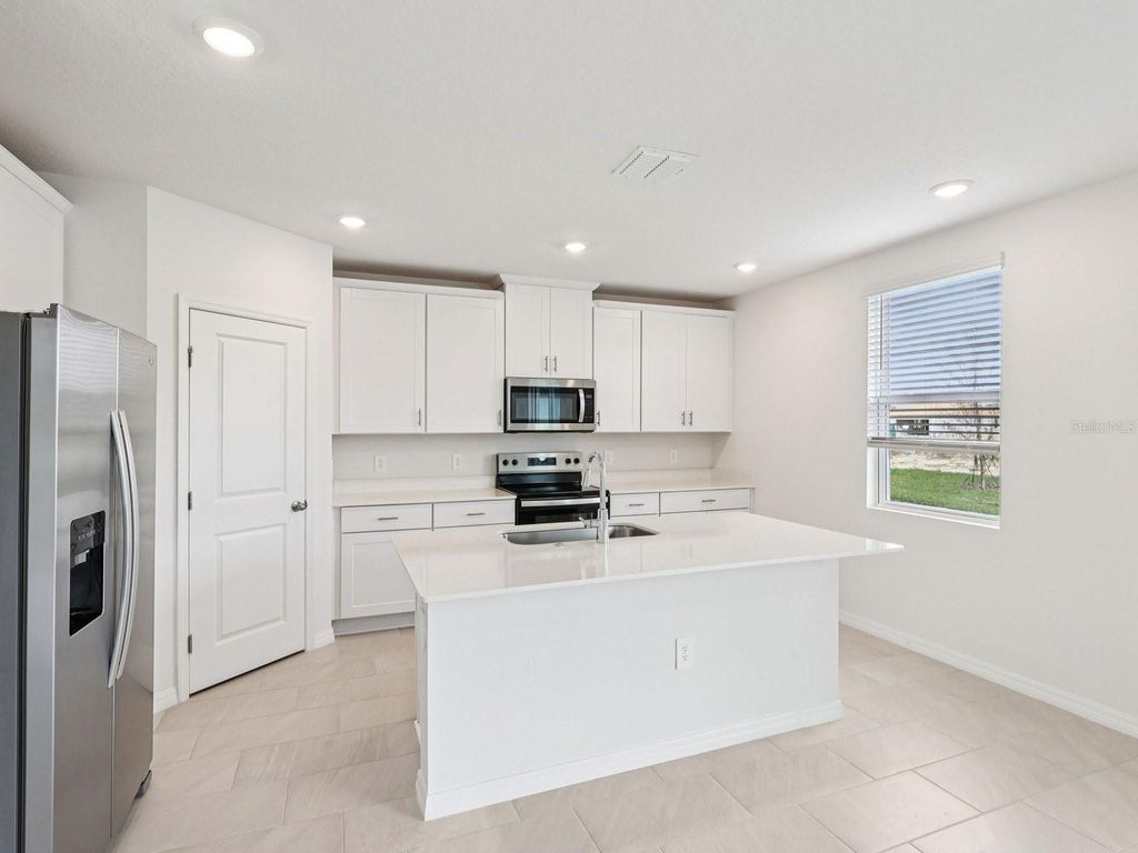 Photo of 799 Sunshower Drive, Lady Lake, FL 32159 (MLS # TB8484366)