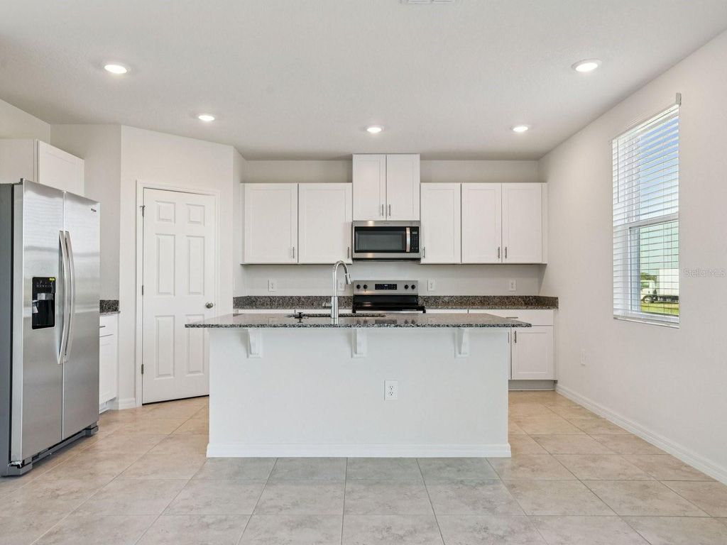 Photo of 799 Sunshower Drive, Lady Lake, FL 32159 (MLS # TB8484366)