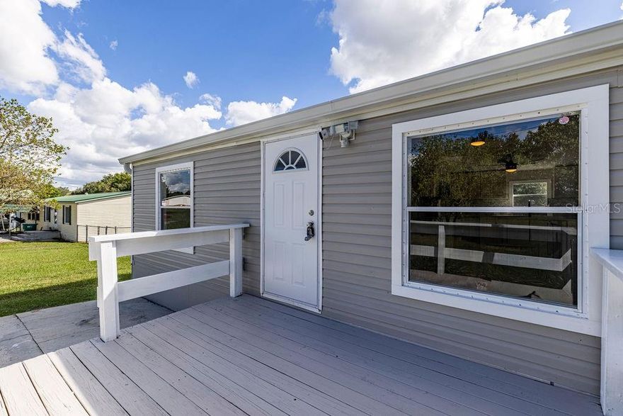 Location! Location! Location! Exceptionally rare, updated property in Lady Lake next to Spanish Springs in the Villages with no HOA or Age restrictions. This gorgeous 3-bedroom, 2-bath home features a spacious kitchen with quartz countertops, soft-close cabinets, matching stainless steel appliances and center island. The home boasts brand new luxury vinyl plank flooring throughout, new windows, and the roof is only a few years old. Nice primary bedroom with large walk-in closet and on suite bathroom. Two walk in showers for easy accessibility. Home situated on a sprawling half-acre lot with fully fenced back yard. Beautifull established yard providing privacy with various established trees, including Red Bottle Brush and Japanese Kumquat among others. This delightful neighborhood offers a perfect blend of peacefulness, affordability, and convenience. A short golf cart ride gives easy access to shopping centers, restaurants, and entertainment in Spanish Springs. Ideal property for families, snowbirds or investors looking for rental income. Don't miss out on this amazing opportunity and schedule a showing today. All information recorded in the MLS is intended to be accurate however, it should be independently verified by buyer and their agent. CHECK OUT THE VIRTUAL TOUR!