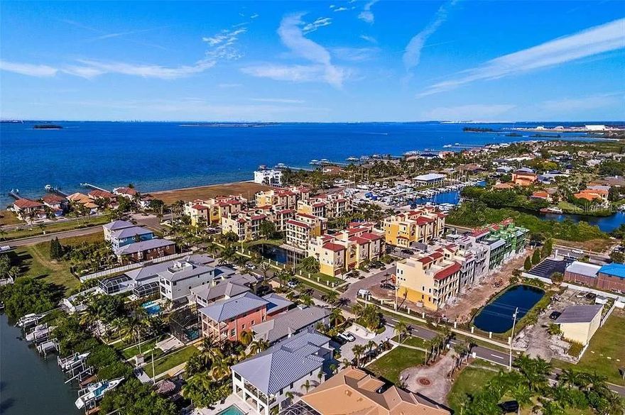 Brisa Del Mar Townhomes – Coastal Luxury in Apollo Beach - Discover Brisa Del Mar, a gated community redefining luxury living in Apollo Beach. Surrounded by multimillion-dollar waterfront homes, these townhomes combine sophisticated design with coastal charm. Choose from two distinctive floor plans: Apollo and Beach. The Beach model offers 3,000+ sq. ft. of refined indoor space, complemented by 577 sq. ft. of covered balconies and an 861 sq. ft. rooftop terrace with stunning canal and bay views. Customize your terrace with an outdoor kitchen and entertainment area, perfect for hosting or unwinding as the sun sets. These thoughtfully designed homes feature four bedrooms, 3.5 baths, and an oversized two-car garage. A private elevator connects all levels, from the versatile first-floor space—ideal as an office, gym, or guest suite—to the open-concept main living area with a designer kitchen, dining bar, and quartz countertops. The third-floor retreat includes a spa-like primary suite with a soaking tub, walk-in shower, and private balcony, plus two additional bedrooms and a shared bath. Built to the latest FEMA standards, Brisa Del Mar offers peace of mind in a prime location. Boating enthusiasts will love the nearby marinas with ramps and the oversized garage for watercraft storage. Just a short golf cart ride to Apollo Beach Preserve, the Manatee Viewing Center, and popular dining spots like Circles and Finns, this community blends natural beauty with modern convenience. With only 14 townhomes remaining, don’t miss your chance to live in this extraordinary coastal haven. Photos are of the Beach model.