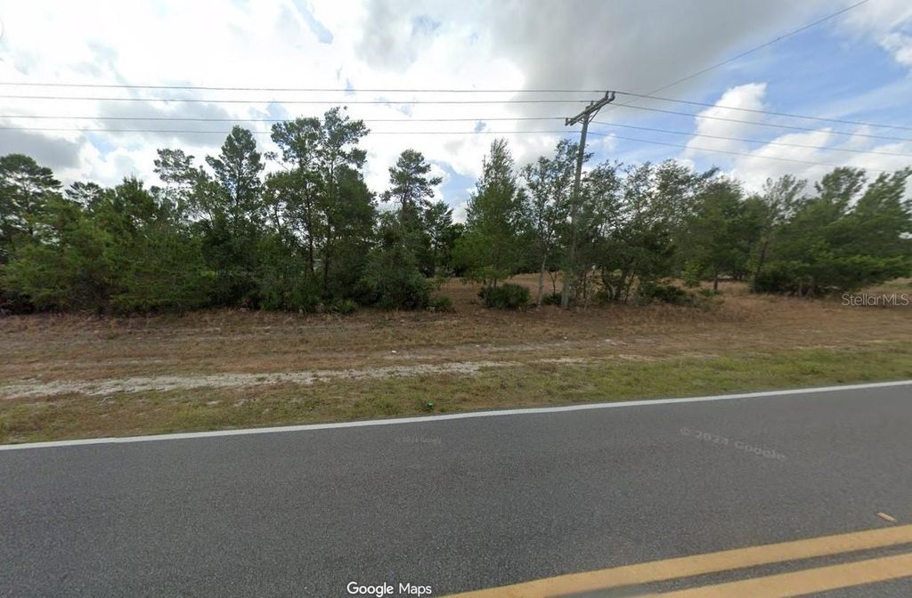 Photo of 10406 S Orange Blossom Boulevard, Sebring, FL 33875 (MLS # O6357029)