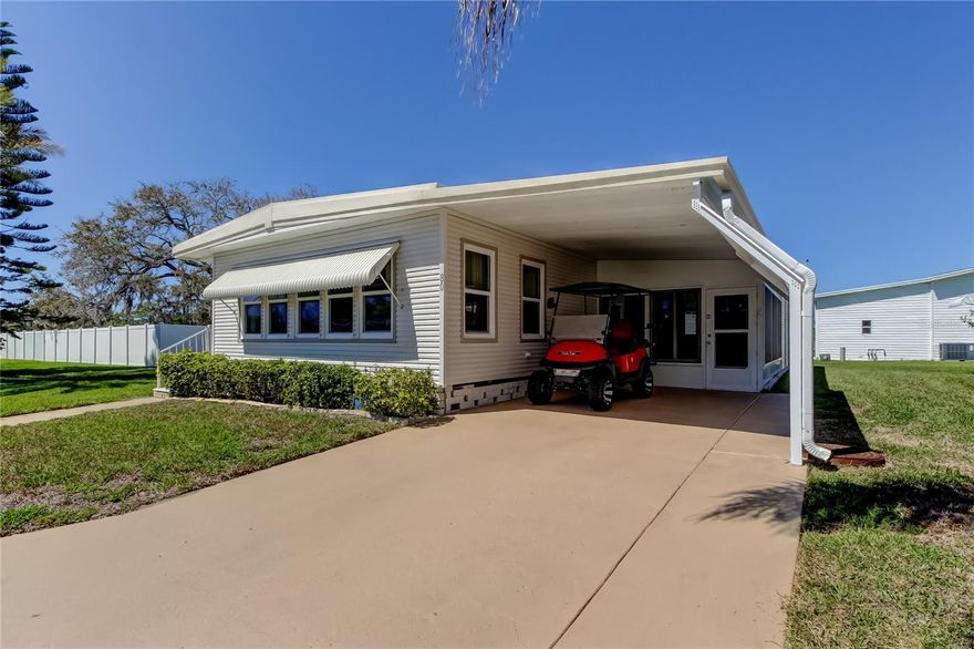 VIBRANT! Active, Adult 55+ Community! Stonehedge on the Hill! Well Maintained Mobile Home Park! Desirable PET FRIENDLY Section! RARE FIND! OVERSIZED LOT! NO NEIGHBOR ON LEFT SIDE OF PROPERTY!! GOLF CART IS INCLUDED! NEWER DOUBLE PANE WINDOWS! 2 Bedroom, 2 Bath with Enclosed Florida Room Plus a 2nd Enclosed Lanai Off the 1 Car Carport! Updates Include: BEAUTIFUL RENOVATED KITCHEN! White Cabinetry with Upgraded Brushed Nickel Hardware, Granite Look Countertops, Stylish Tile Backsplash! Newer Stainless Steel Appliances! Built In Buffet Provides Additional Storage! New Light Fixtures! Ceiling Fans! Neutral Decor! En Suite Primary Bedroom and Guest Bedrooms Feature Large Walk In Closets! BOTH BATHROOMS HAVE BEAUTIFUL NEW VANITIES!! Walk In Shower! Spacious Great Room Floorplan with Eat In Kitchen! Luxury Vinyl Plank Flooring! Low Maintenance! FURNITURE CAN STAY! Shed/ Workshop Off the Carport! Stackable Washer/ Dryer Stay! NEWER Electrical Panel (3 yrs old) Water Heater - Seller has a Plan w/ Duke Energy to Repair or Replace, if needed. NOT a Land Lease! Property has Awnings and Shutters! AFFORDABLE HOA Fee Includes: Active Clubhouse Featuring a Resort Style Heated Pool, Shuffleboard Court, Water, Sewer, Trash, Lawncare, Basic Cable, Exterior Pest Control and Street Lights! Nearby Hospital, Restaurants (Ride your Golf Cart to Cody's Roadhouse), John Anderson Park, Amazing Fred Howard Park Beach with White Sugar Sand! Pinellas County Trail for Walking or Riding your Bike! Historic Downtown Quaint Tarpon Springs, Home of the Sponge Docks! Fill your Social Calendar with Something Fun to Do Every Day! Easy Access to Tampa International and St Pete/ Clearwater Airports! Schedule a Cruise out of the Port of Tampa Nearby! HOA Approval is Required! Buyer Must Contact the Association for Approval! Background and Credit Check As Well as In Person Interview with Board Members. Ample Guest Parking at Clubhouse! Furniture is Included. Must See Inside to Appreciate! Come Start Enjoying the Florida Lifestyle!