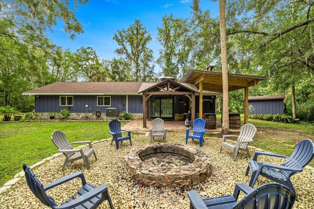 This beautifully updated 3-bedroom, 2-bathroom ranch-style retreat offers the best of Florida living with modern conveniences and unbeatable access to nature.
Step inside and fall in love with the stunning chef’s kitchen, complete with an oversized island, custom hickory wood cabinetry, stainless steel appliances, and generous prep space... perfect for entertaining or quiet family meals. The open-concept family room features rich stained & stamped concrete flooring flowing seamlessly into the kitchen and dining area, offering flexibility, style, durability, and ease of maintenance throughout. Need extra space? A versatile flex room awaits. This space is ideal as a home office, game room, guest space, or owner's closet for all of you investors out there.
Outside, you'll find a spacious RV pad with full hookups, a rare and valuable feature for travelers or visiting family. The property also boasts a 2-car attached garage, utility shed, and pergola. So no matter your taste this home offers ample storage and outdoor enjoyment.
The crown jewel of this home? Private community water access just a short stroll away. Launch your kayak or boat, fish the day away, or swim alongside the iconic manatees in the crystal-clear spring fed river. A community dock provides easy access and is exclusive to this neighborhood.
Other upgrades include new Pella windows (2024), solar panels, new AC units & mini splits, and gutter guards. These upgrades help to ensure comfort, efficiency, and peace of mind for years to come.
Set on nearly half an acre of lush, private land, with no HOA and plenty of room to breathe, this home is a rare blend of modern living, natural beauty, and old Florida charm.
Looking for a new adventure? The location can't be beat! You are only a short golf cart ride from all of the hottest local spots, whether that is grabbing a bite at The Old Mill Tavern, a drink at The Monkey Bar, singing Karaoke at MacRae's, getting some fresh seafood at The Freezer, or checking out all of the fun shops in historic Homosassa. Not to even mention the proximity to Tampa, Orlando, and Ocala... this home has all of Central Florida at its fingertips.
Don’t miss your chance to own a slice of paradise!