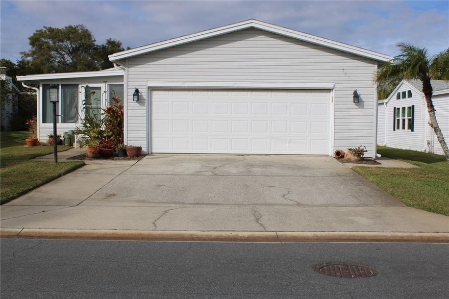 Come see this spacious 2bed/2bath Palm Harbor home with open floor plan, large primary suite and ceiling fans throughout. This home is move-in ready with a new roof in March of 2025 & new skylight. No popcorn ceilings here, X-large 2 car garage w/strengthened garage door and plenty of space for your golf cart, etc. The whole house was re-plumbed on 4/28/2023, home is on its own lot on a cul de sac w/ a 95' deep well for irrigation. New hot water heater on 4/28/2023 & irrigation pump 11/2021. Seller has paid the $10,000.00 assessment. Come enjoy all the amenities at Edgewater Landing.