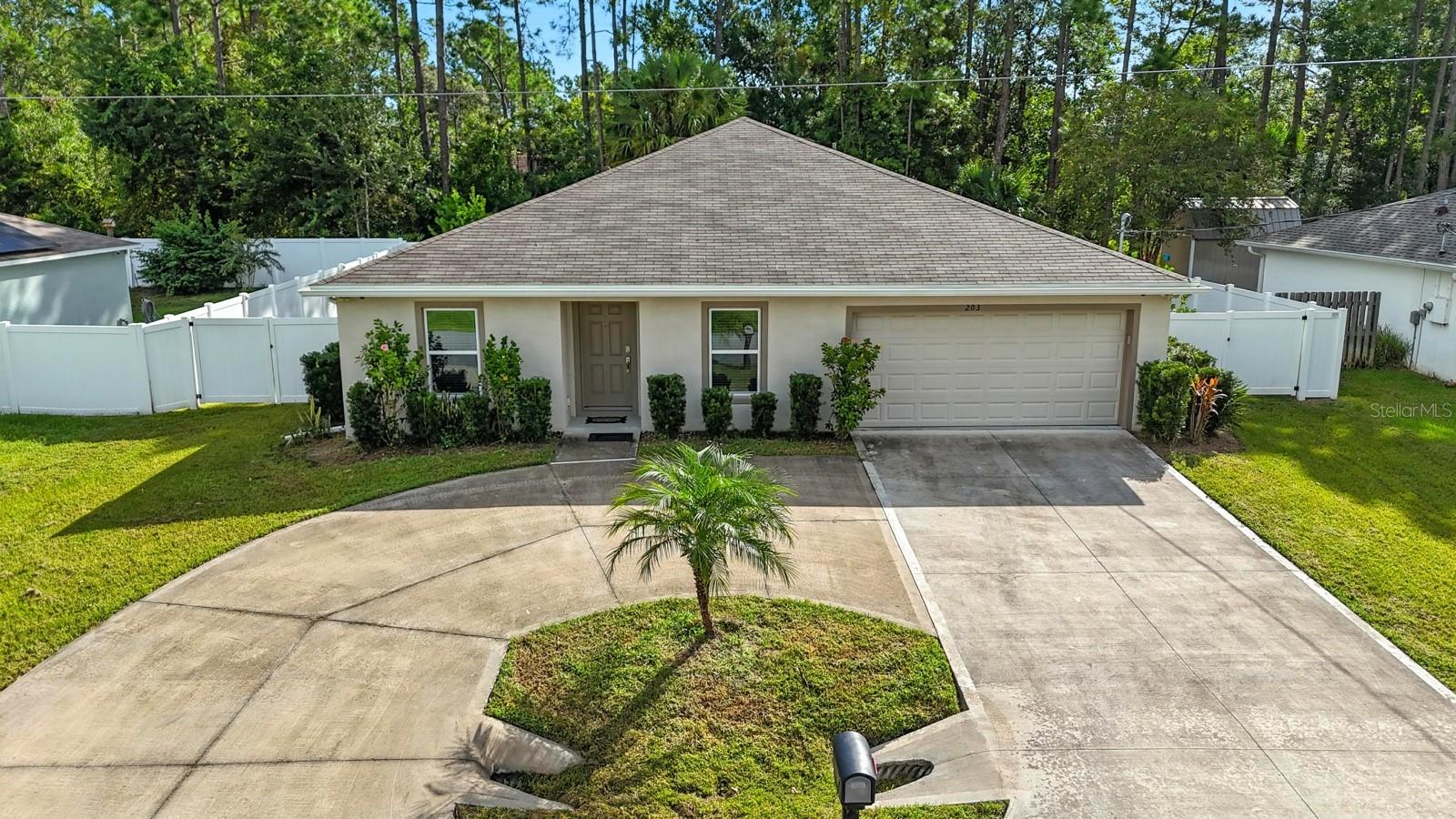Welcome to 203 Palmwood Drive, a beautifully updated home in the heart of Palm Coast. From the moment you arrive, the large roundabout driveway makes coming and going easy, offering plenty of space for guests and everyday convenience.
Inside, you'll find stylish LVP flooring flowing throughout the home, updated cabinets, and brand new ceiling fans in every room, creating a fresh and modern feel. The split floor plan provides privacy in the bedrooms while keeping the living areas open and inviting perfect for family living.
Step out back to your own private retreat, fully fenced with clean white vinyl. An extra concrete pad is ready for you to design your backyard paradise, whether it's grilling out, entertaining friends, or simply relaxing.
Located in the heart of Palm Coast, this home is close to scenic trails, parks, and pathways ideal for outdoor exercise.