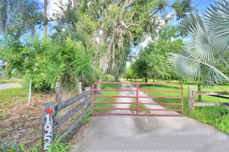 This stunning, custom-built 4-bedroom, 2-bathroom home spans 2000 sq ft on 9.75 well-maintained and cleared acres! Situated just off Lake Hamilton Drive, the property includes a spacious kitchen with an oversized breakfast bar that opens to a screened lanai—ideal for entertaining and casual dining. The master suite features his-and-her closets, elegant granite countertops, and a luxurious walk-in shower. A 4-stall horse barn with a tack room enhances the property’s equestrian appeal. The fully fenced, cleared land boasts a picturesque pond, providing a serene setting for those seeking tranquility and privacy. This rare estate offers an unparalleled opportunity for both residential comfort and outdoor enjoyment. Don't miss out on this extraordinary property!