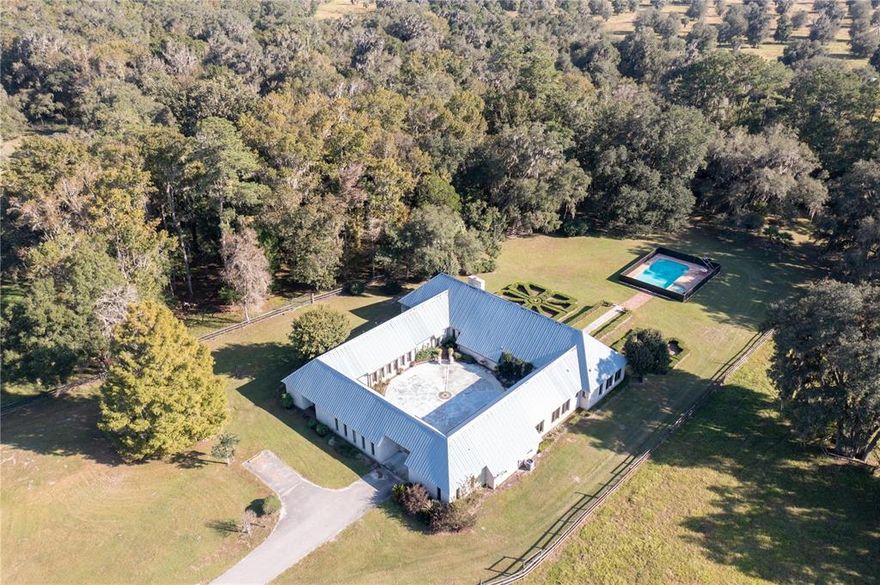 Amazing 800+ acre wildlife preserve and horse farm, this farm has it all.

Located in the beautiful rolling hills of NW Marion County this farm is truly a gem to behold.

The stately home was crafted by a top designer with enough room to accomodate a large family. Featuring a huge kitchen, five bedrooms and four baths with a courtyard style area with inground pool. Many custom features include a deluxe kitchen, custom cabinetry, formal dining, private den, spacious master suite, plus guest quarters overlooking lush green pastures and pool. 

Zebras, giraffes, wild game and even rhinos used to roam around this beautiful stretch of land that features giant Oaks, ponds, several barns and some amazing vistas.
The horse farm area is comprised of about 180 acres, having a perfect set up for training and breeding, and was built by one of the most prominent horse trainers in Ocala. Additional farm amenities include a 12 stall center aisle barn, a 40X60 large barn with 14 foot sliding doors, a maintenance shop, small house plus 2 mobile homes. The separate gated entrance off 318 leads to a 24 stall barn with apartment, a covered Eurociser & a swimming pond for horses that is perfect for layups or conditioning your horses, RV hookups, and lush green paddocks with automatic waters. 

To get a tour of this incredible property call today!