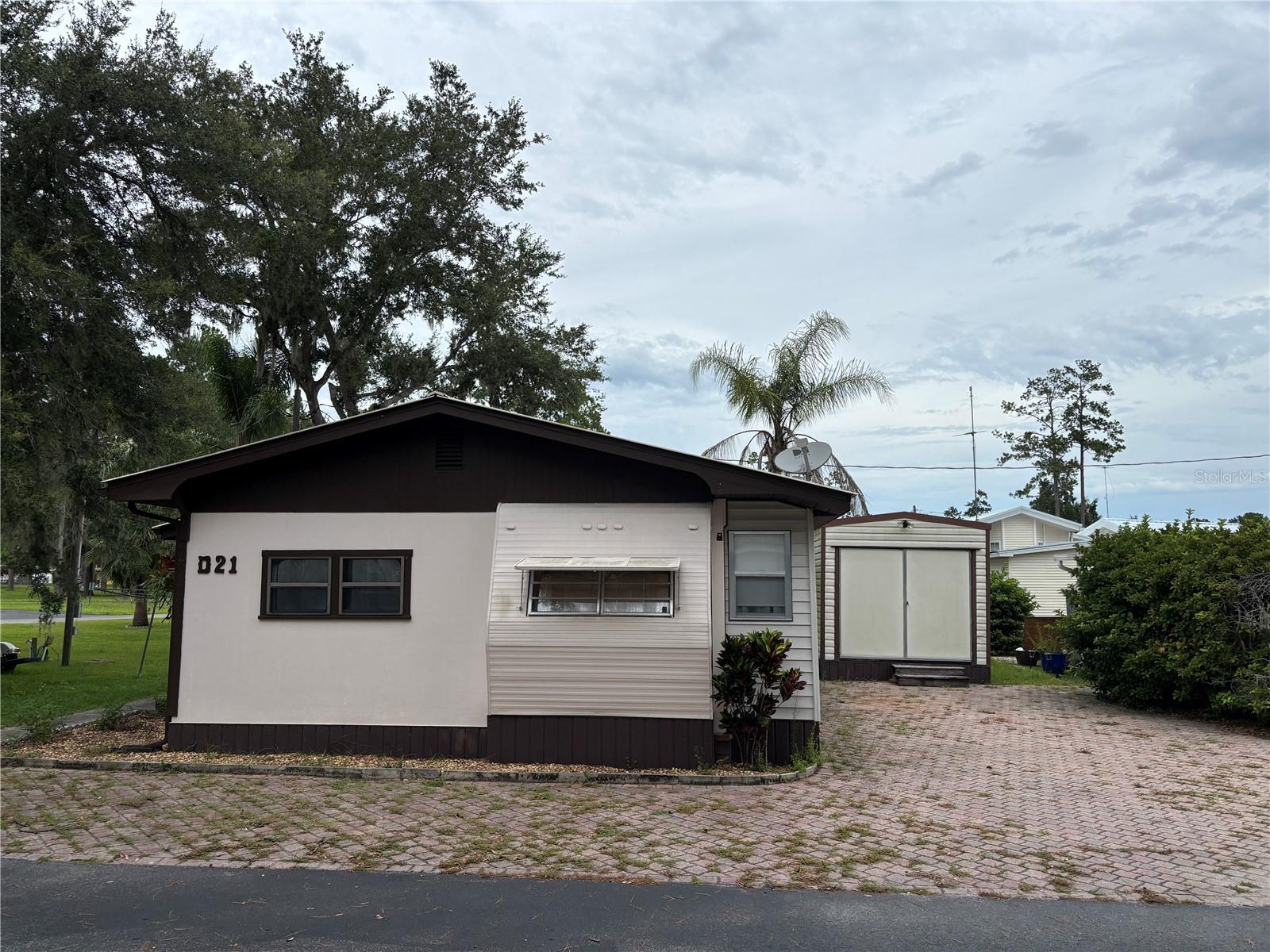 Welcome to Campers Holiday, a 55+ Gated Community in Hernando County. Own Your Home & Land! The Community Features a Private Lake w/Dock, Playground, BBQ Picnic Area, Laundry Facilities, Dog Park, Club House w/Heated Pool, Library, Pool Tables, Shuffleboard, Event Room w/Stage & Lots of Activities. Low Condominium Quarterly Fees include Water, Sewer, Internet/Cable TV & Trash Service. Located on a Dead End road to the Lake, this 2 Bedroom 1 Bath Home is Fully Furnished & Ready for New Owners. Enjoy Morning Coffee on the 8'x12' Rear Deck. The 10'x20' Workshop/Shed w/Electric has Plenty of Storage. Whether You are Looking for a Permanent, Vacation or Rental Home, this is a Must See. Call Today for Your Private Showing.